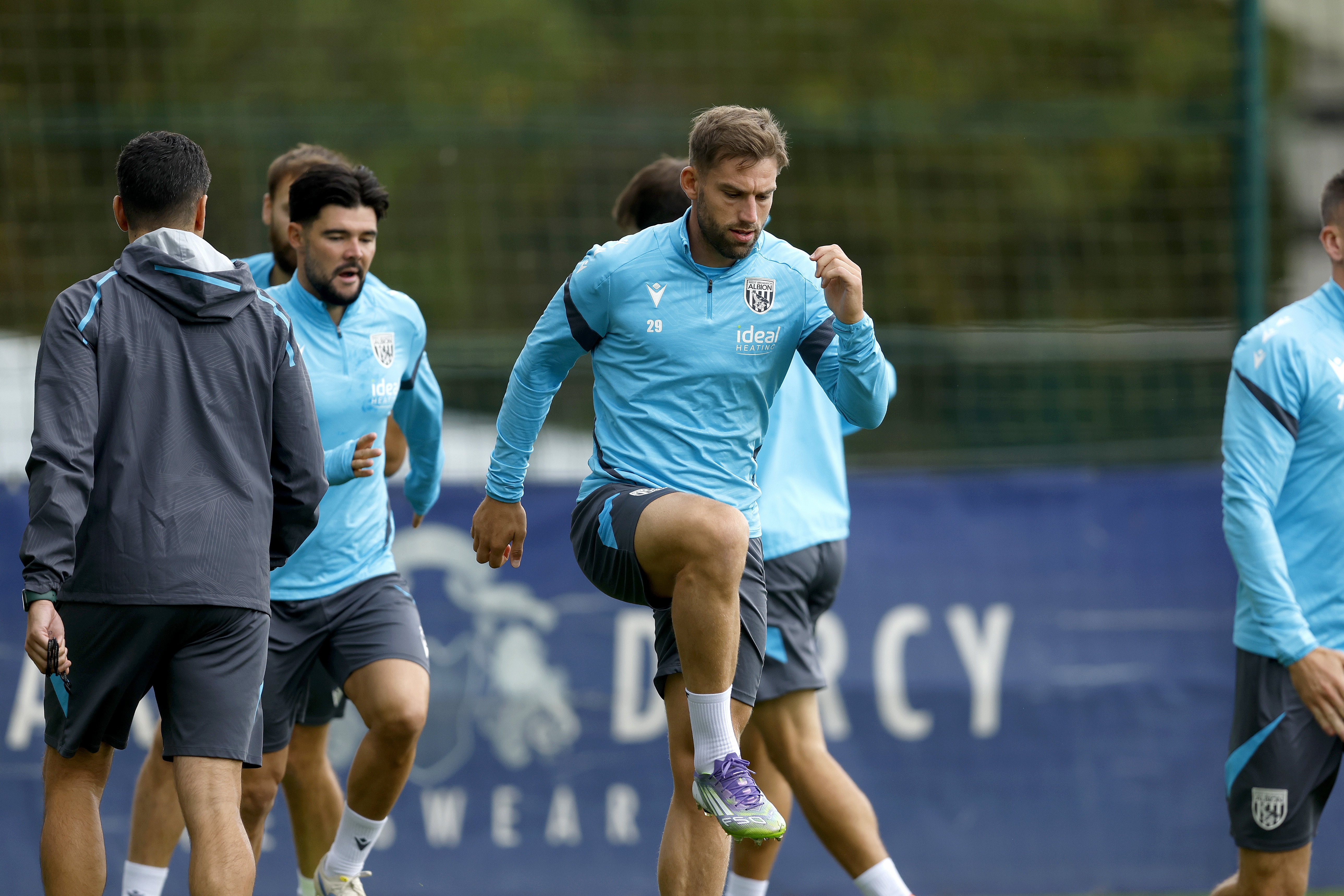 Charlie Taylor warming up before training