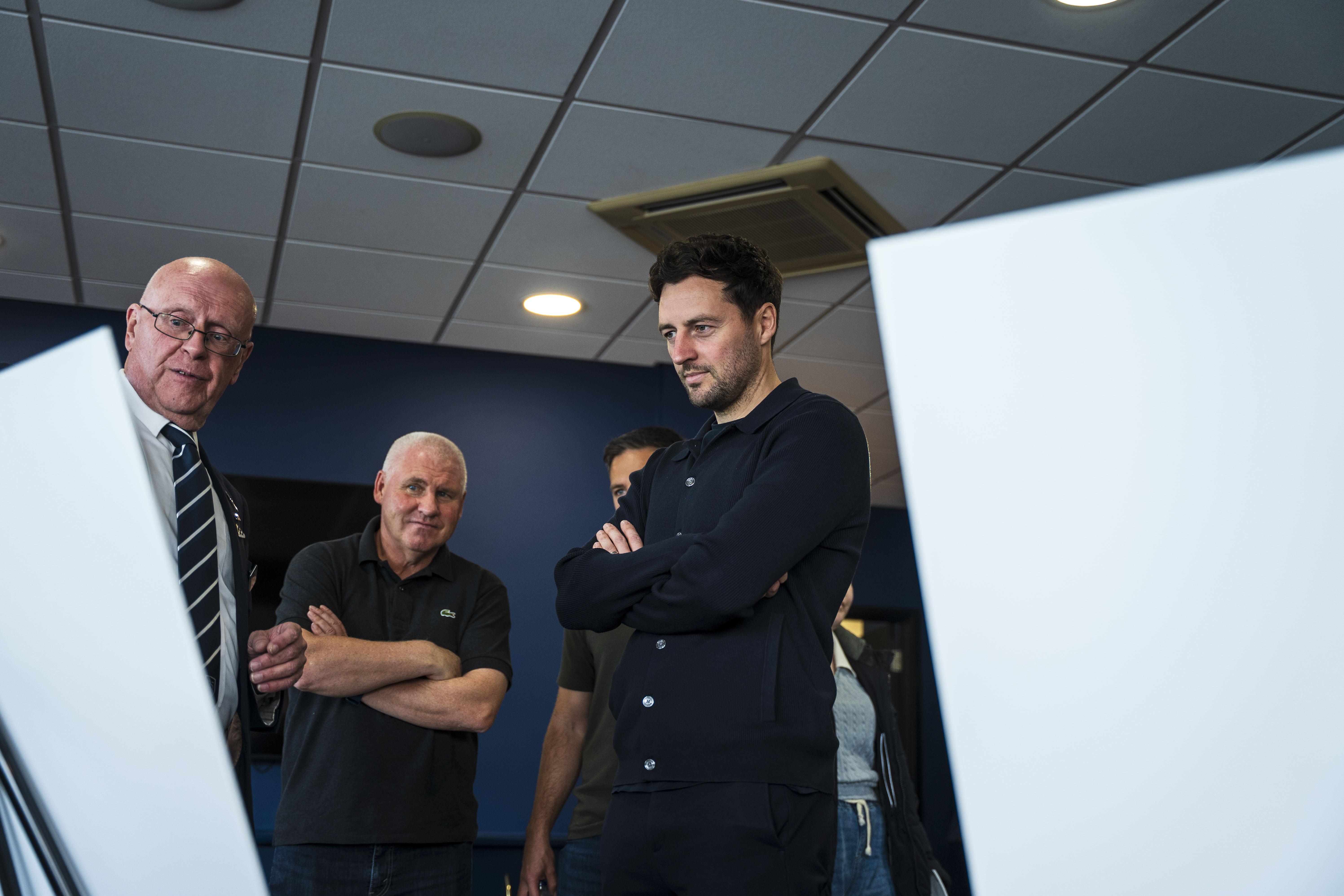 Ryan Mason looking at all the memorabilia and a specially curated gallery of 125 iconic Hawthorns images