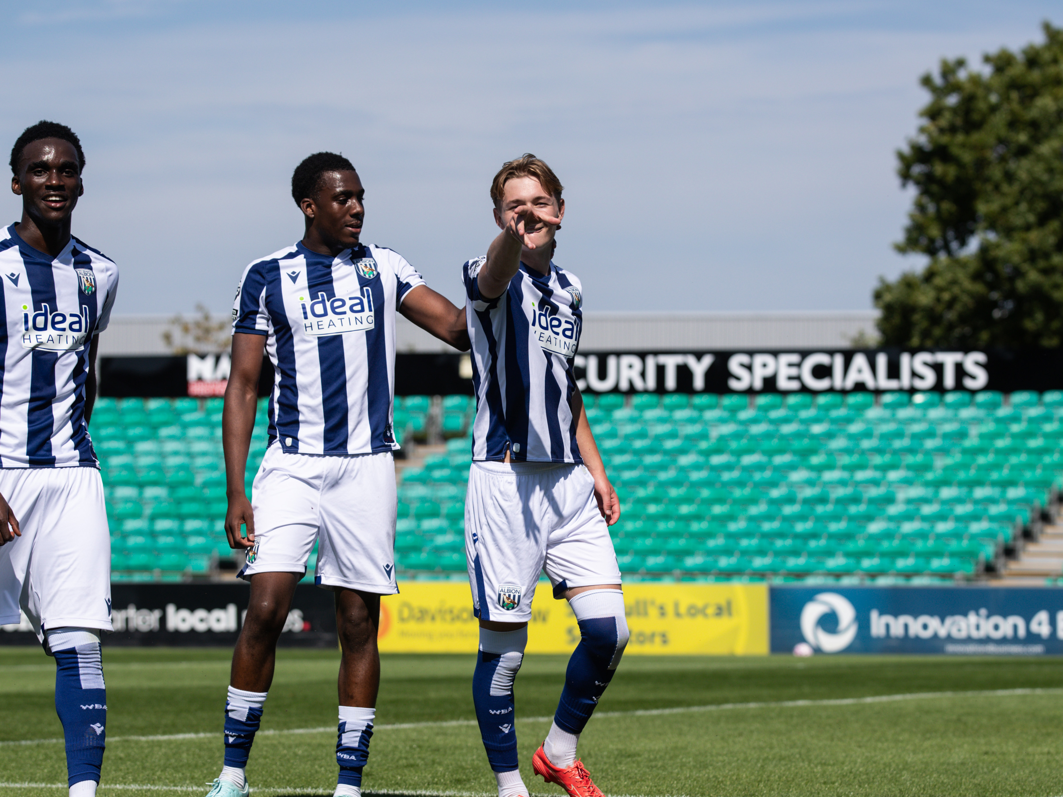 A photo of Ollie Bostock celebrating in Albion's 2025/26 home kit
