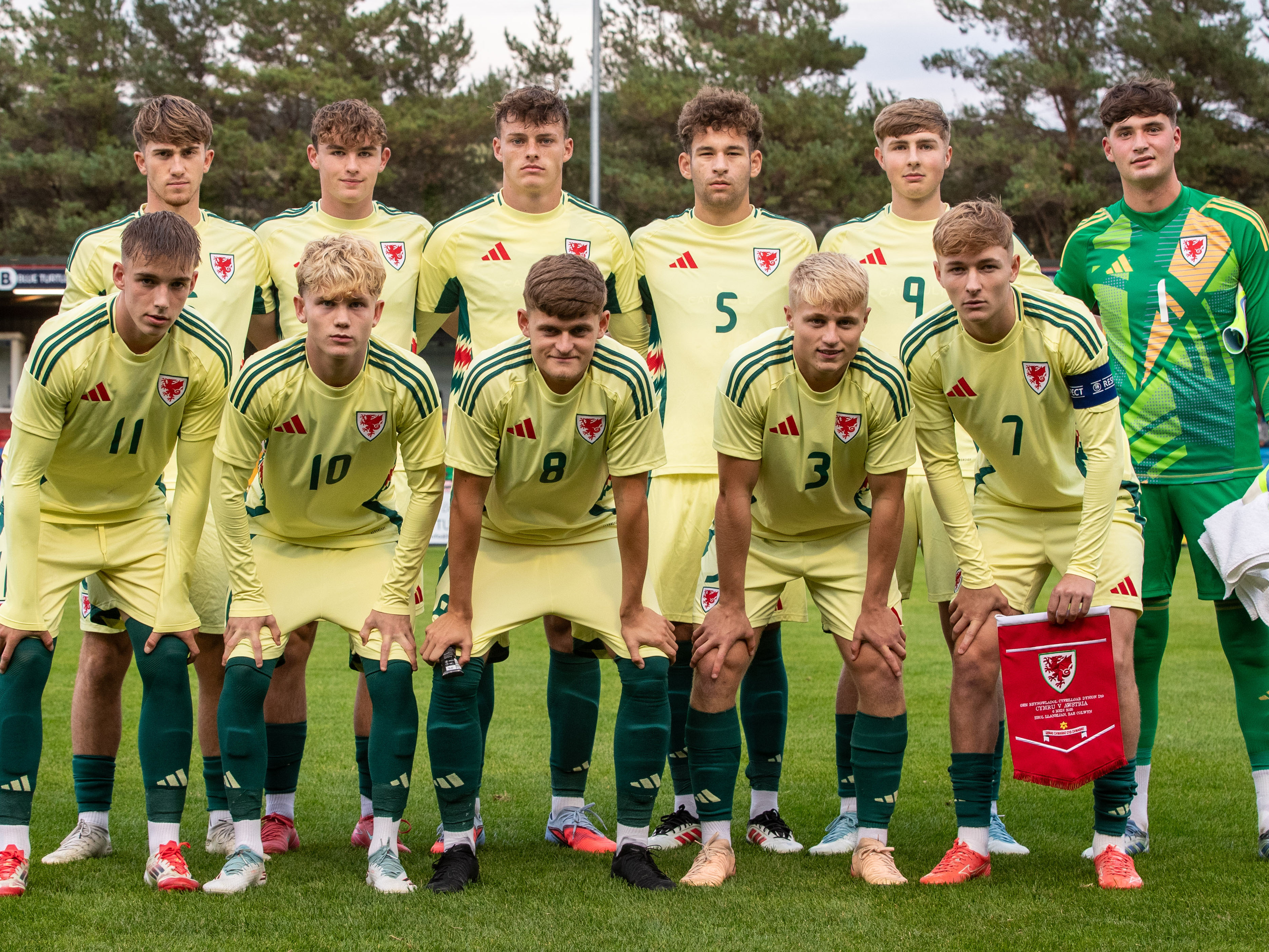 A photo of Ollie Bostock as captain of Wales U19 in a group shot with his countrymen before a friendly