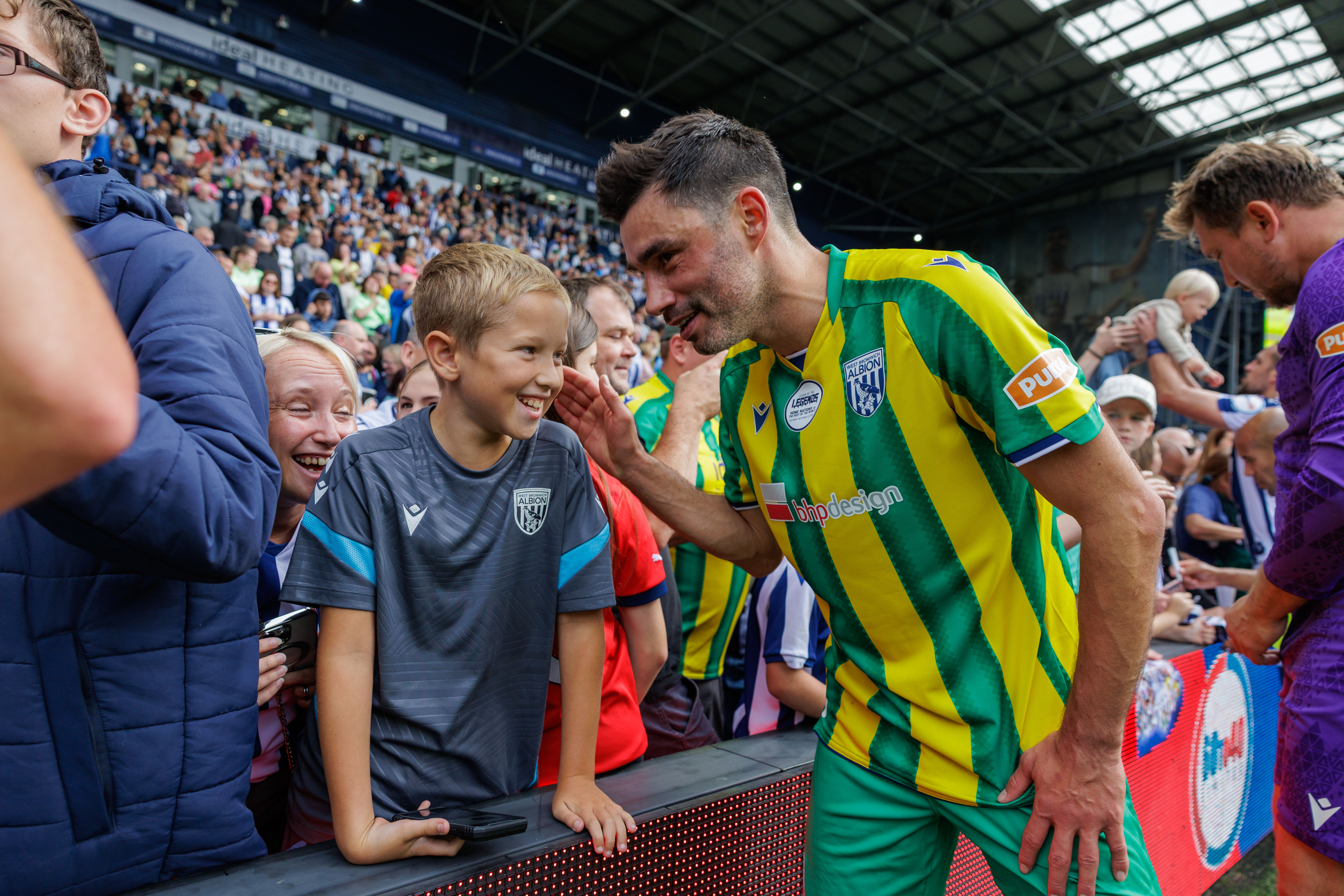 Claudio Yacob and a fan at The Hawthorns.
