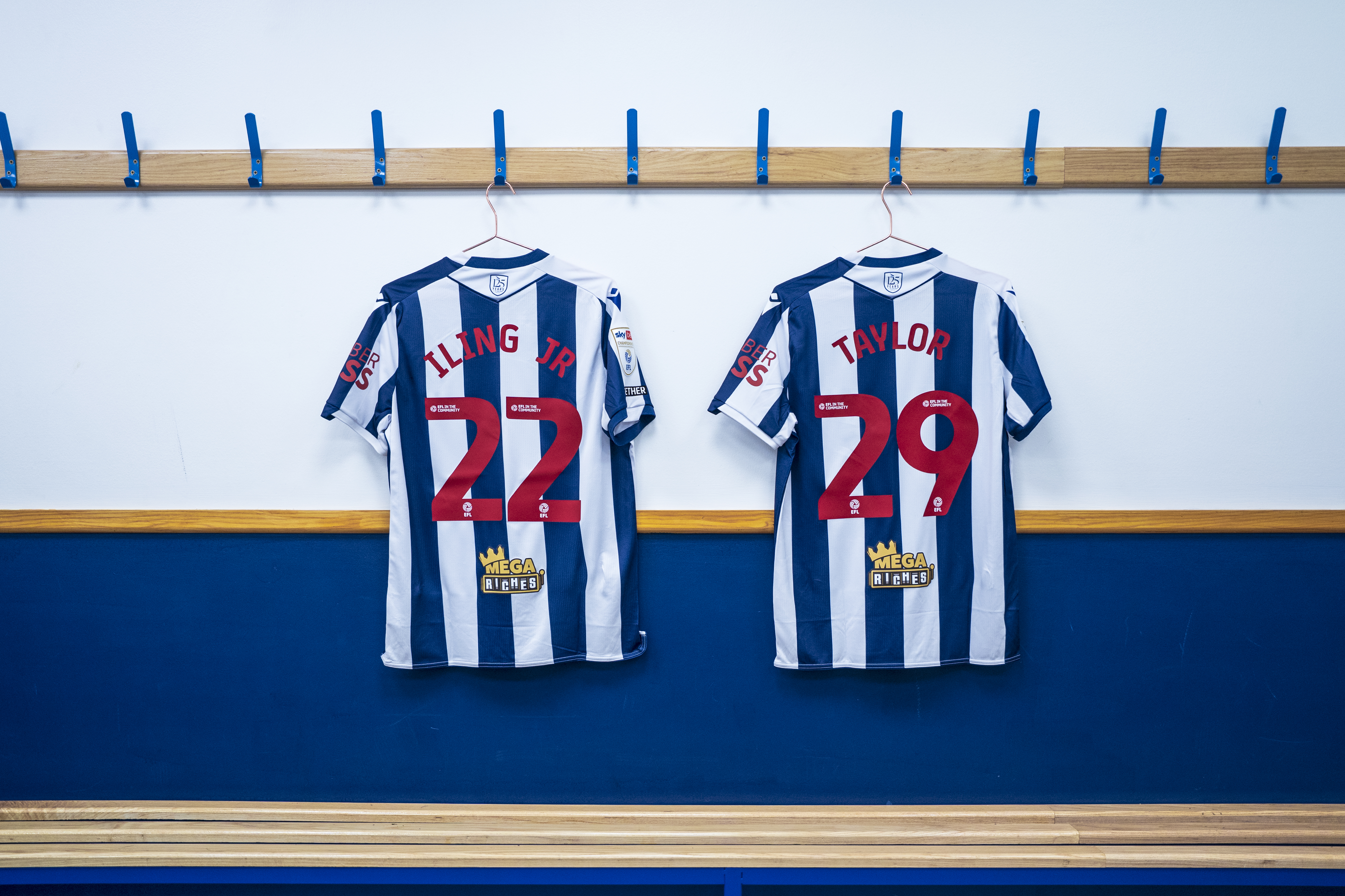 Samuel Iling-Junior's number 22 shirt and Charlie Taylor's number 29 shirt hanging in the dressing room