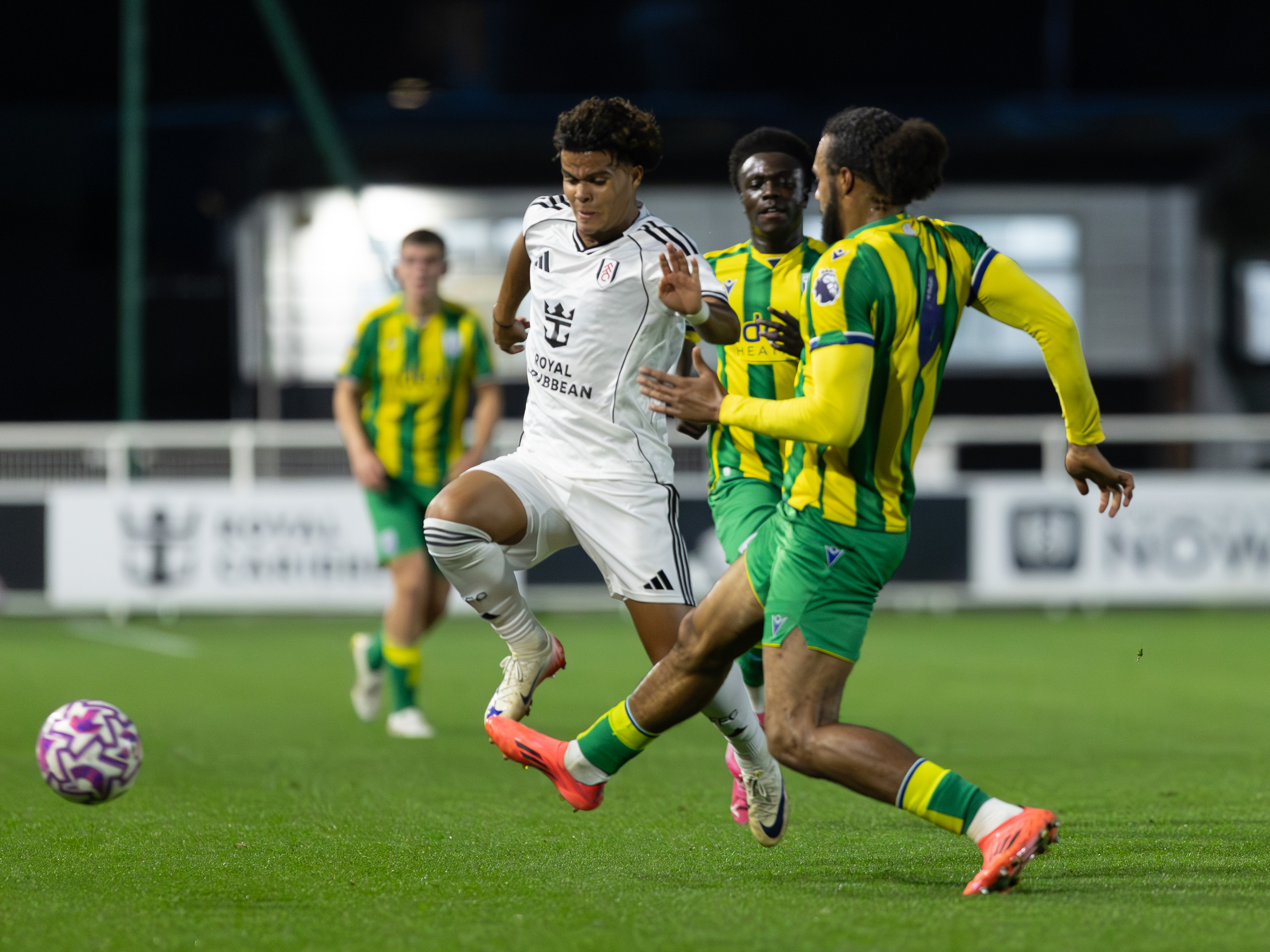 A photo of Albion youngsters competing in a PL2 game against Fulham wearing the 2025/26 green and yellow kit