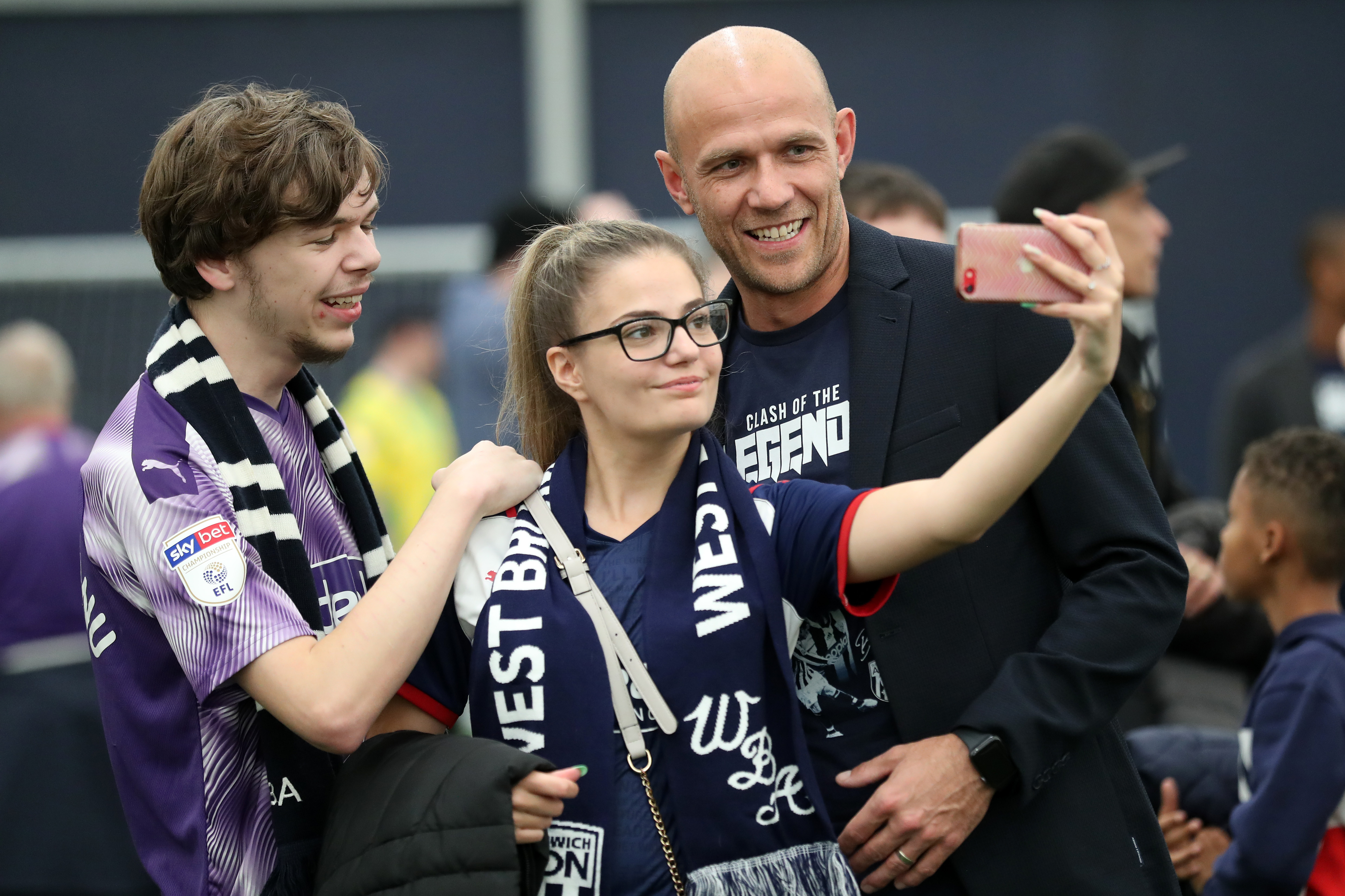 Roman Bednář poses for photos with fans.