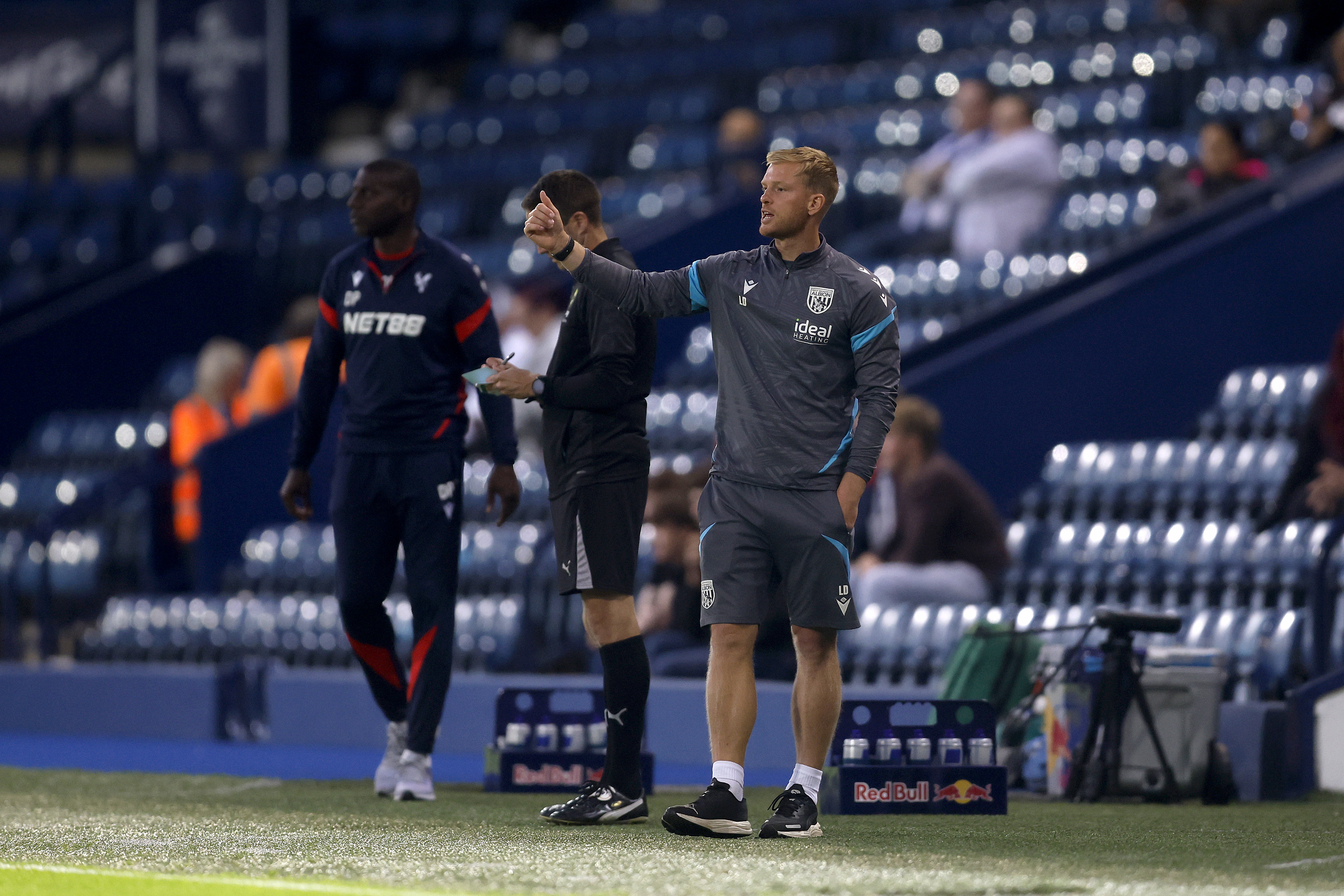 PL2 boss Leigh Downing on the side of the pitch at The Hawthorns 