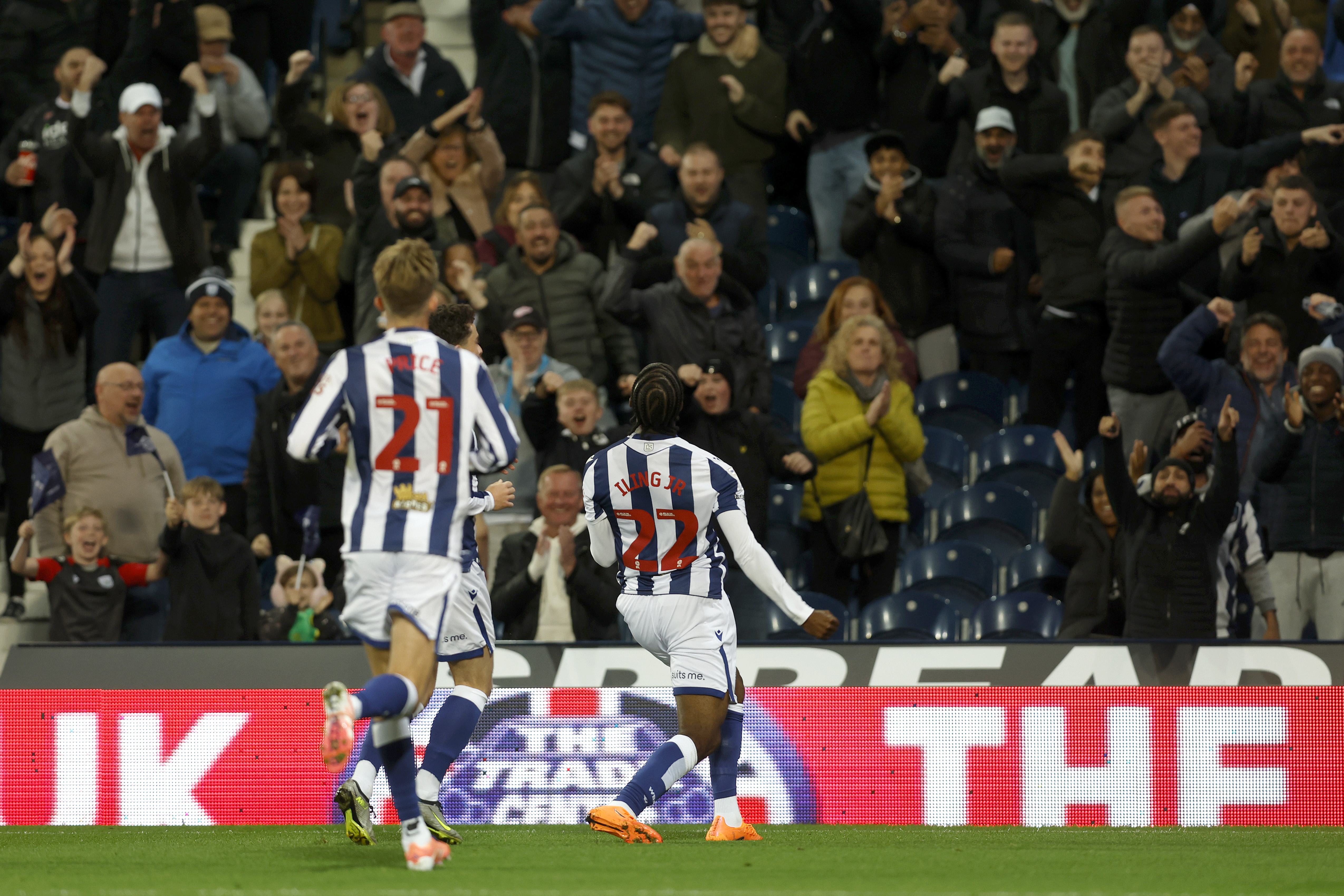 Samuel Iling-Junior celebrates scoring a goal for Albion in the home kit 