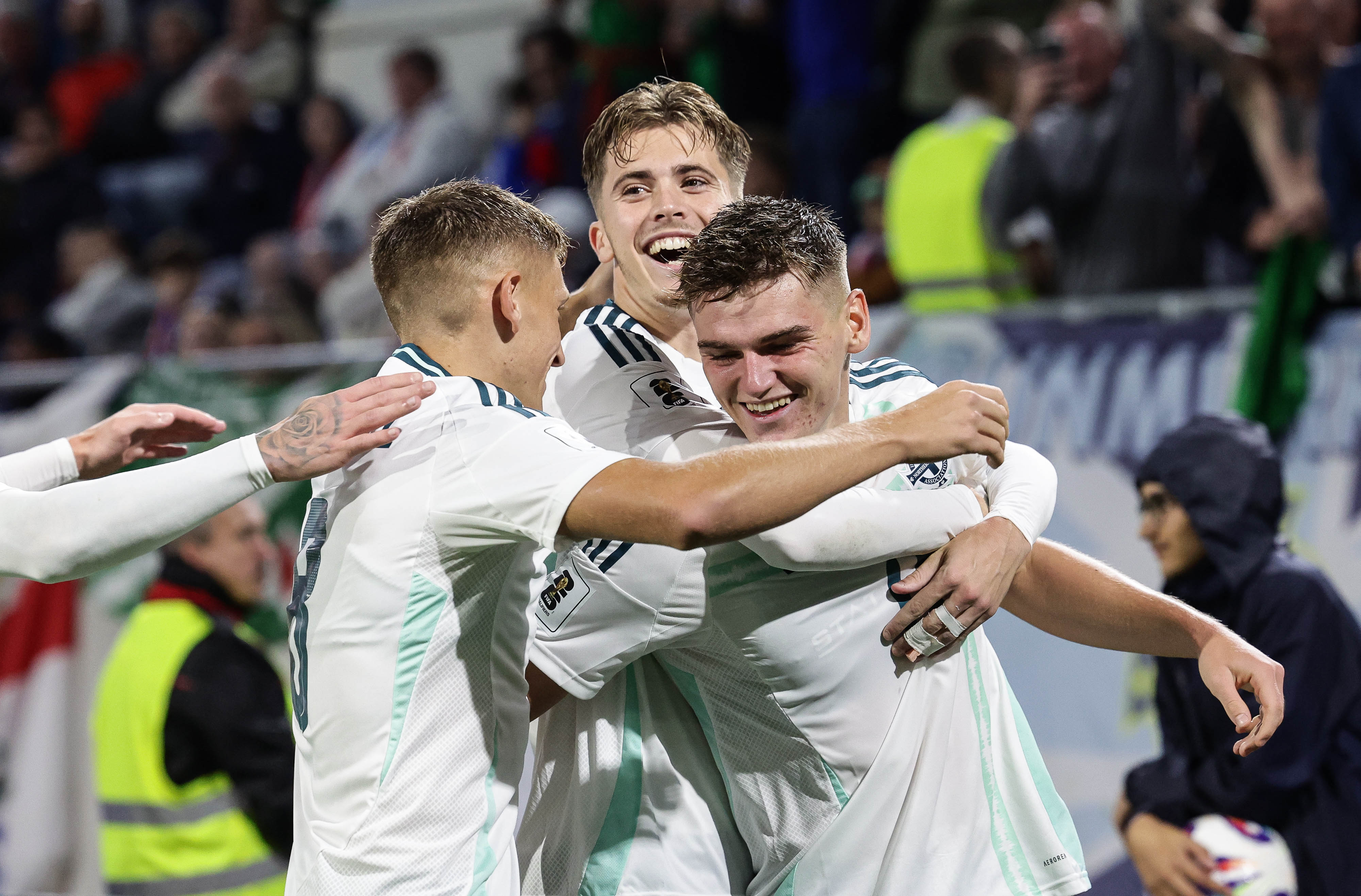 isaac Price celebrating a Northern Ireland goal with his team-mates