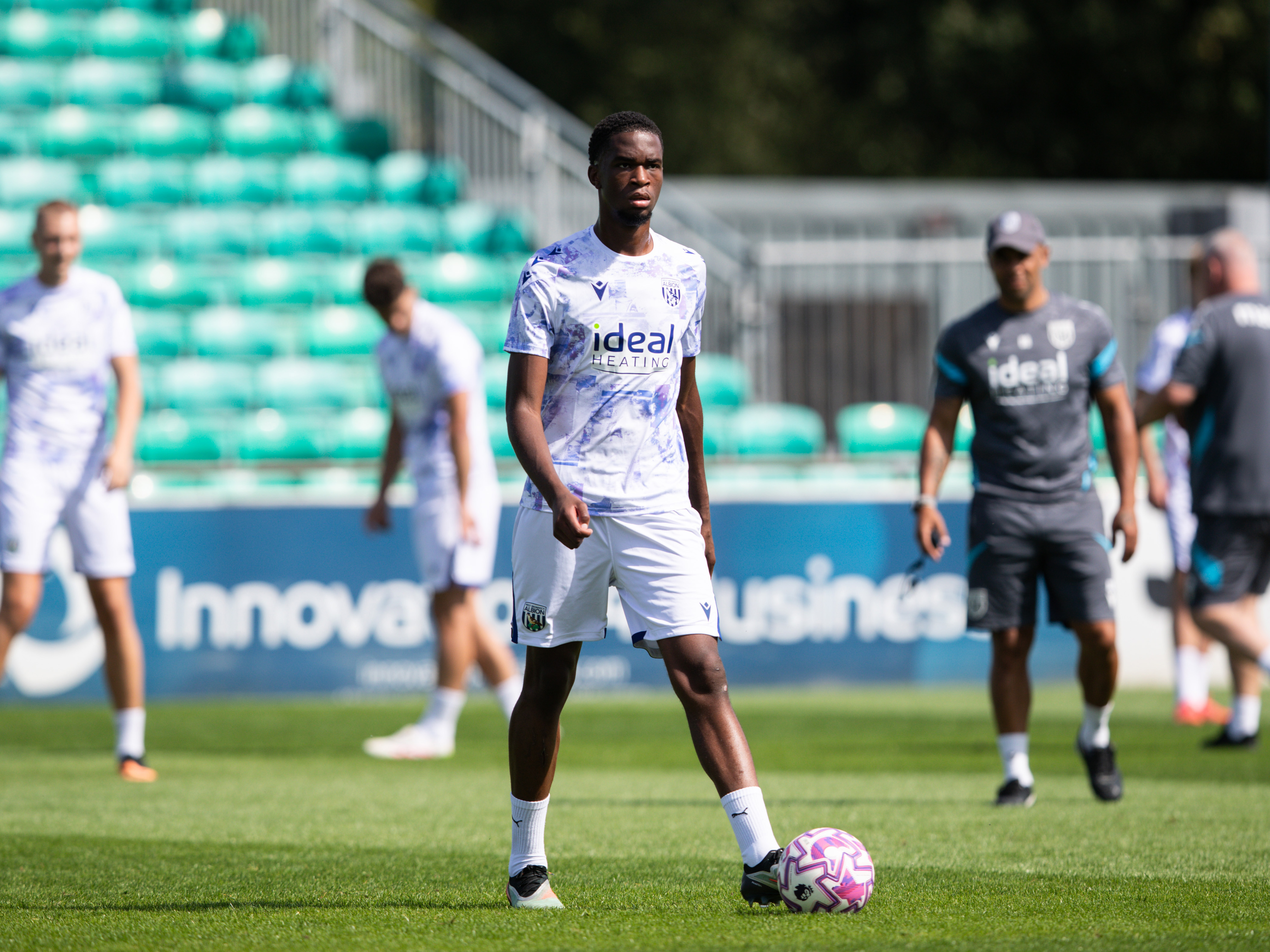 A photo of Albion U21 midfielder Kevin Mfuamba in the 2025/26 warmup kit
