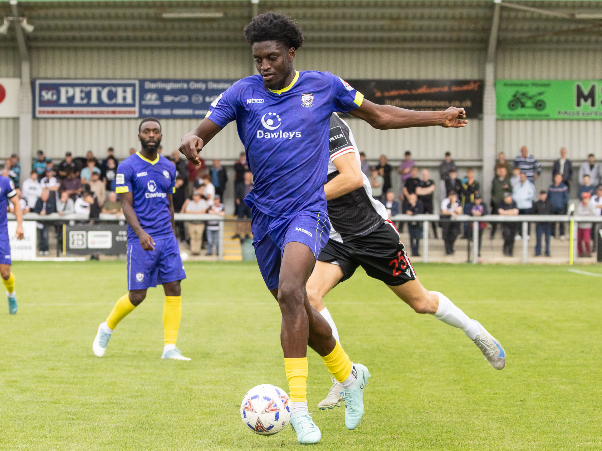 A photo of Michael Parker in the purple away kit of loan club Hereford