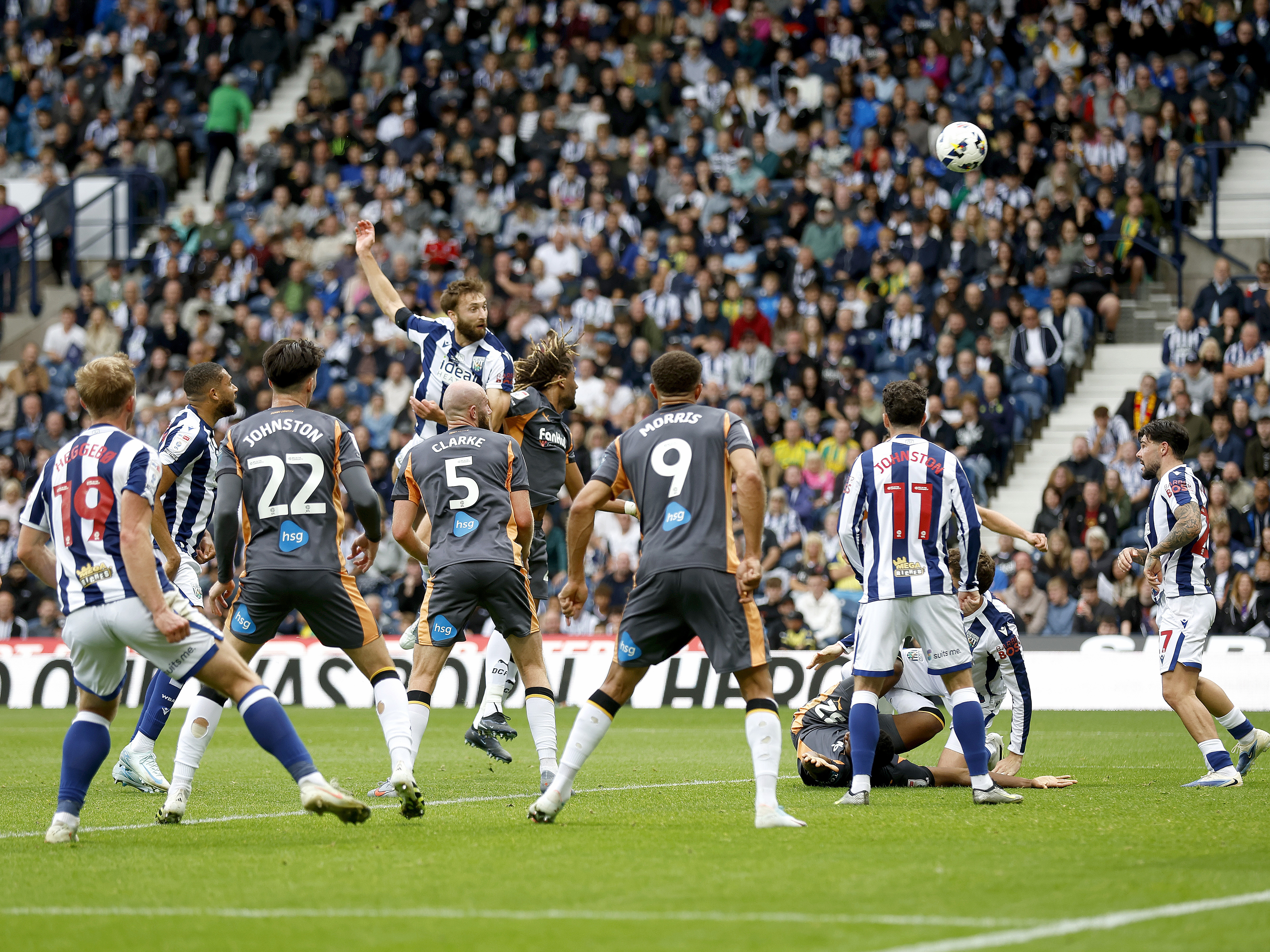 An image of Nat Phillips heading the ball against Derby