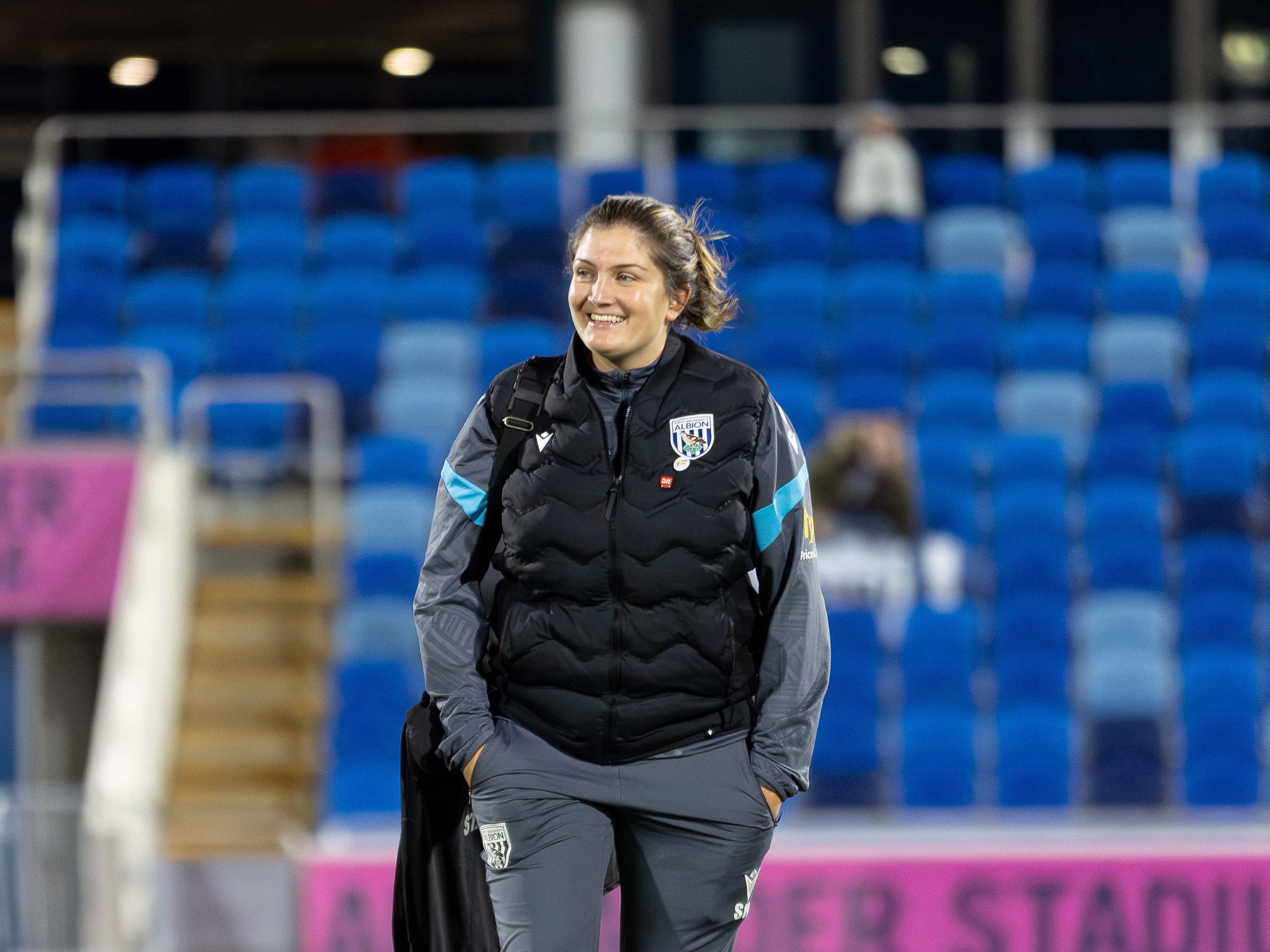 Siobhan Hodgetts-Still smiling while in a WBA tracksuit