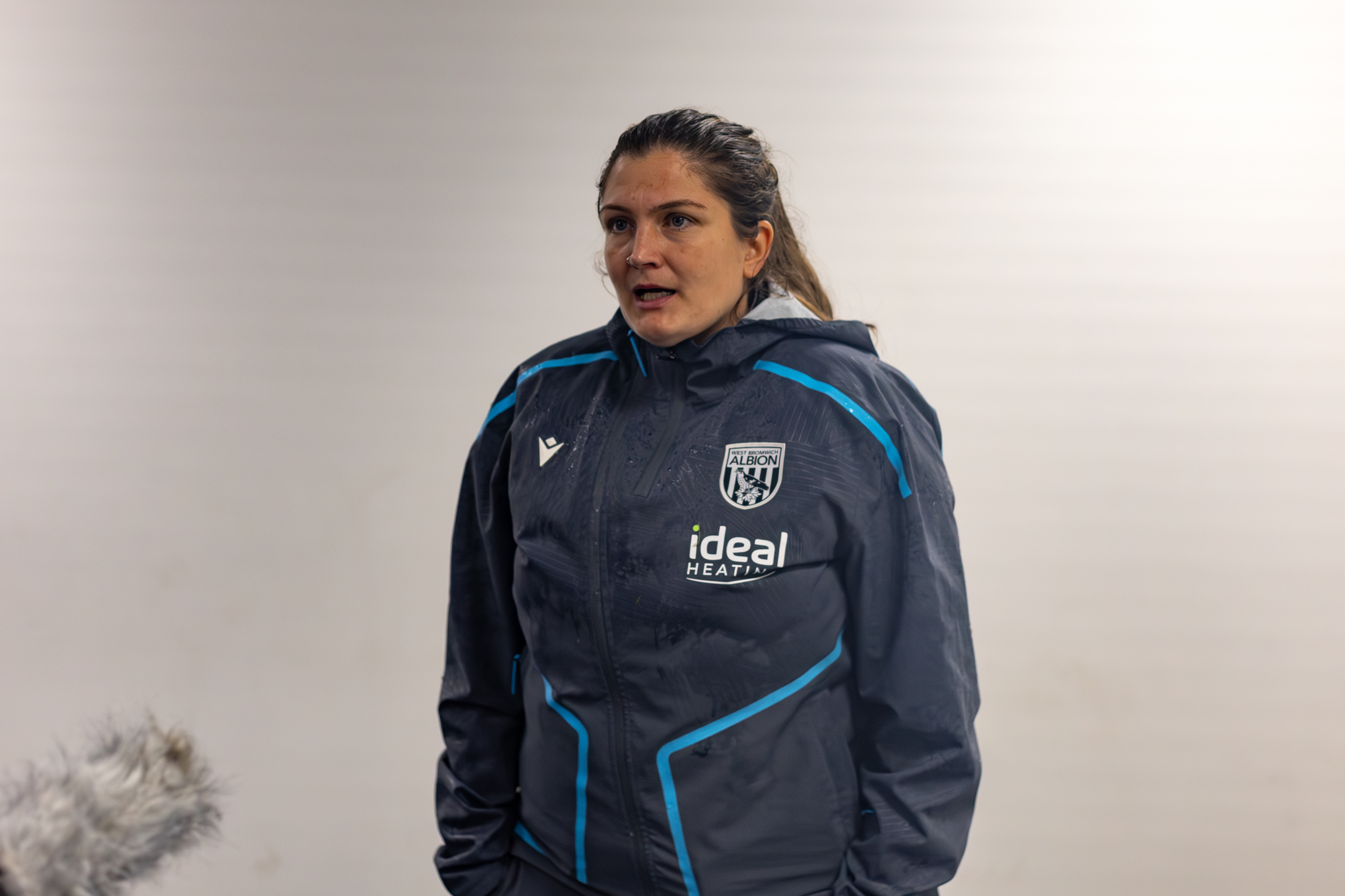 Siobhan Hodgetts-Still being interviewed after a game in a WBA tracksuit