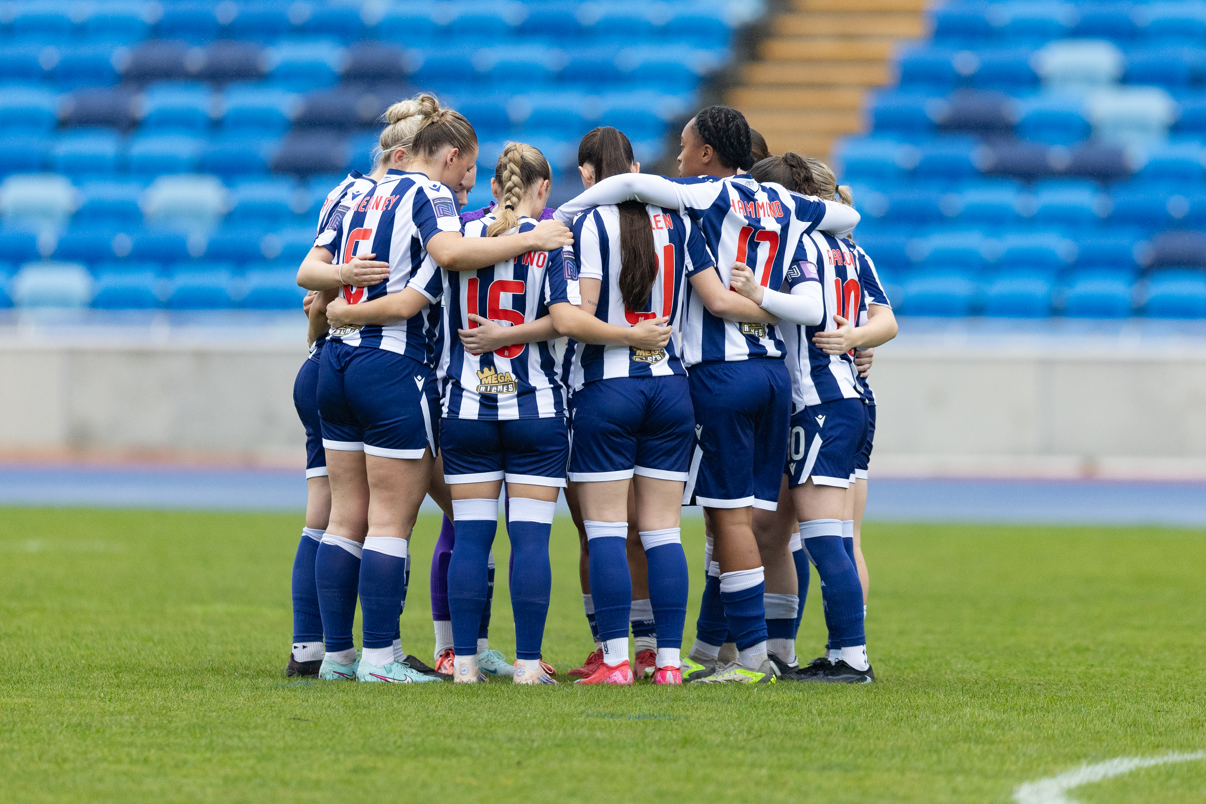 Albion Women in a pre-match huddle before the game with Boldmere in the home kit