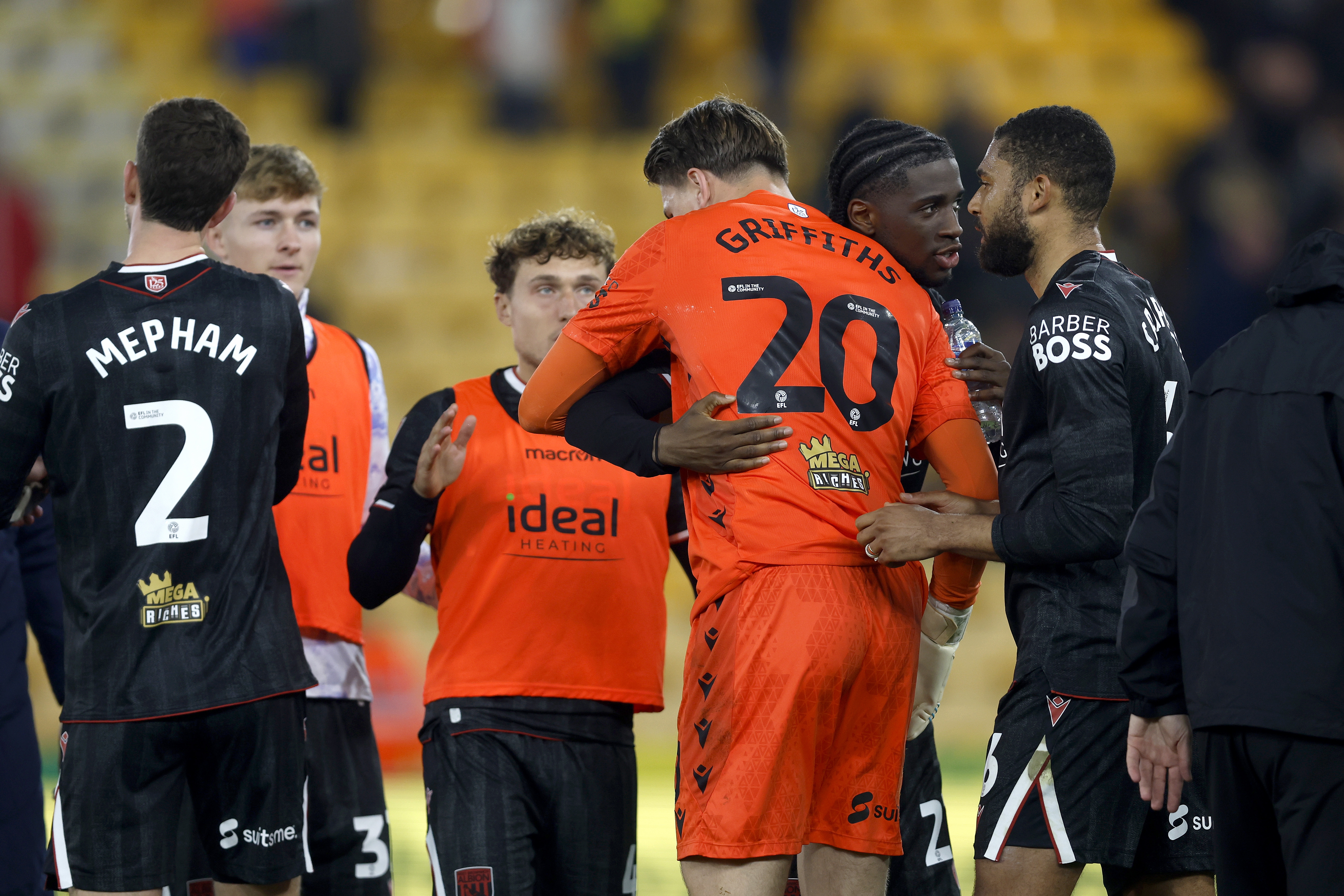 Josh Griffiths is congratulated by team-mates at full-time against Norwich 