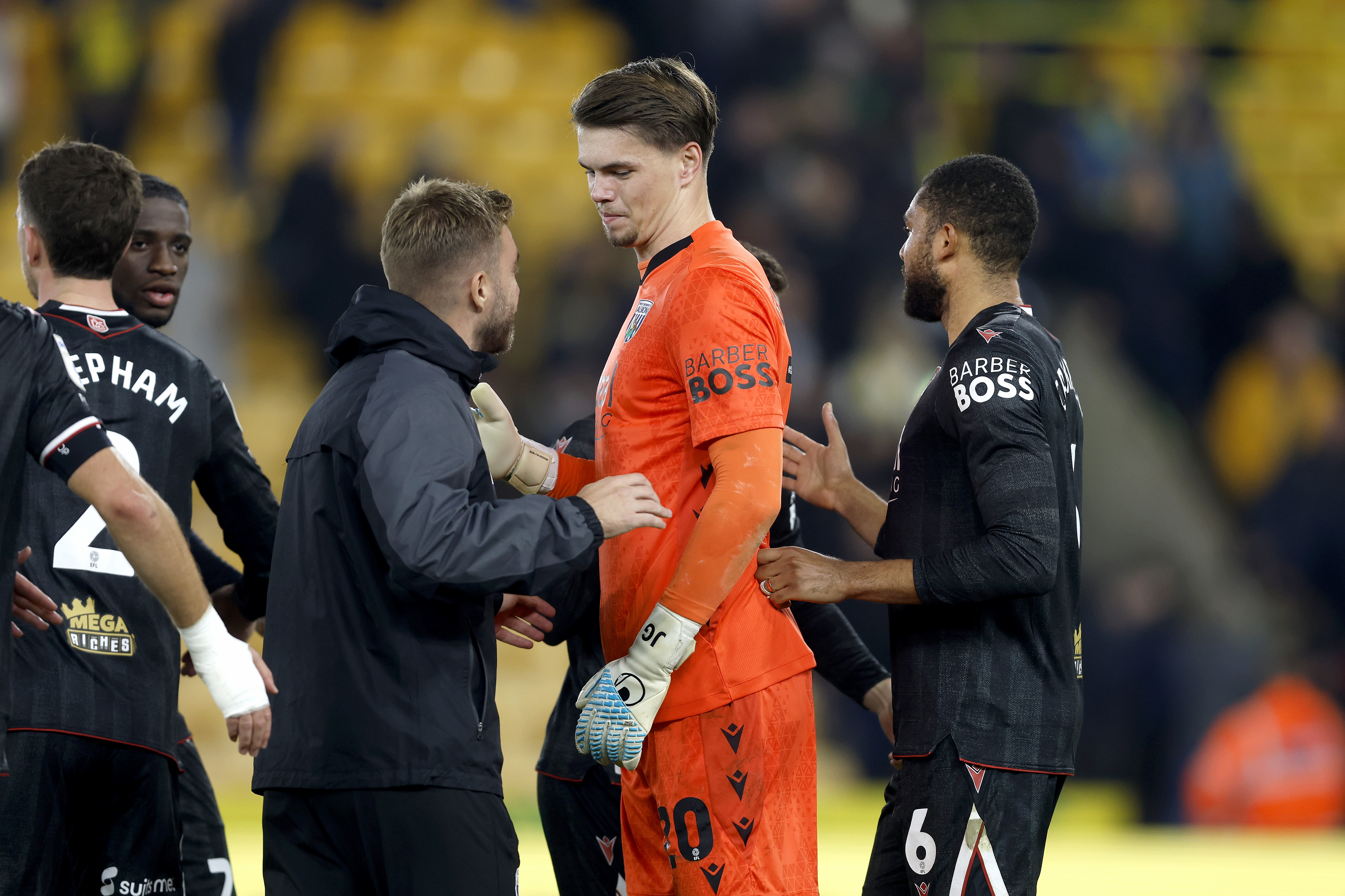 Josh Griffiths is congratulated by James Morrison at full-time against Norwich 