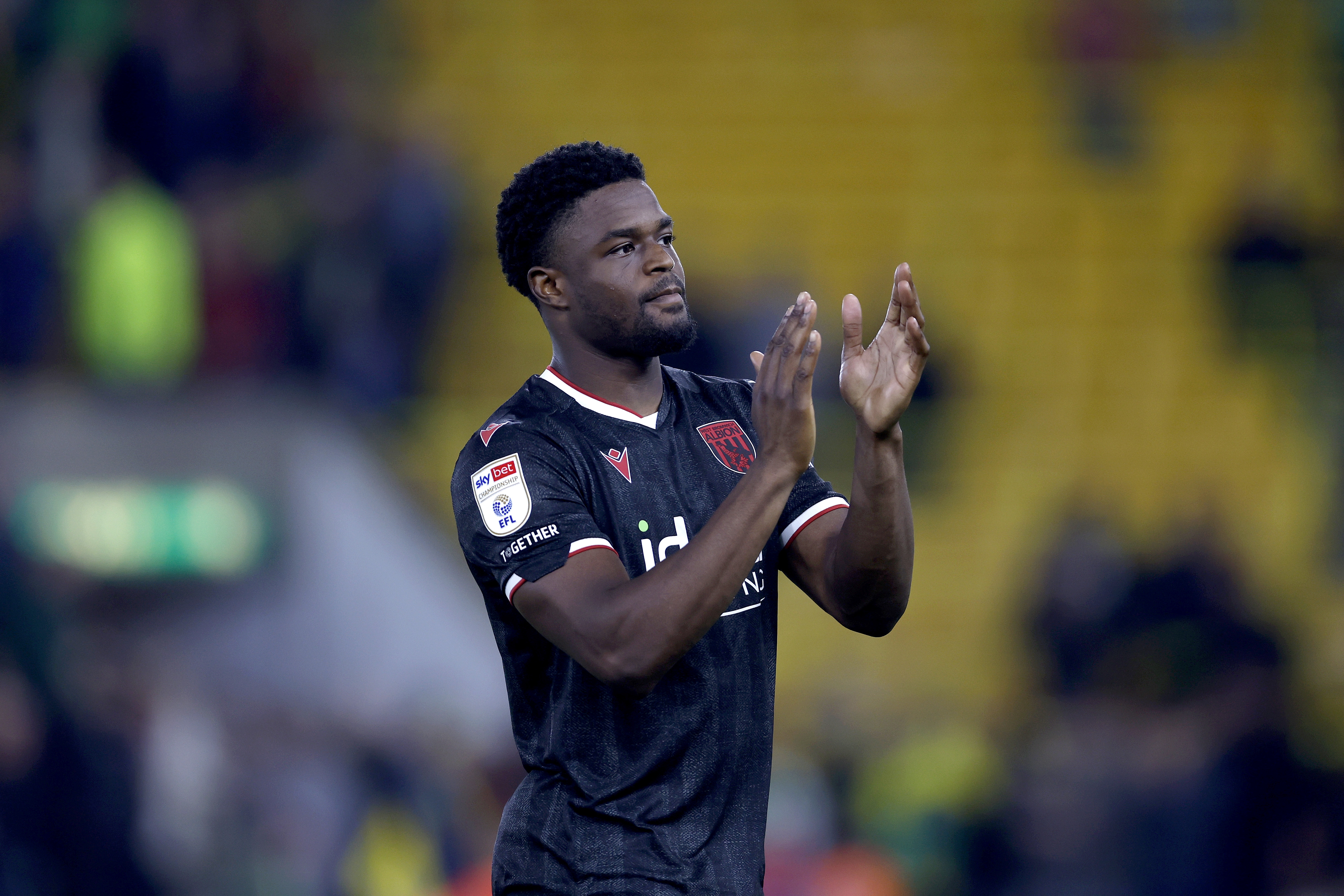 Josh Maja applauds WBA fans after the win at Norwich 