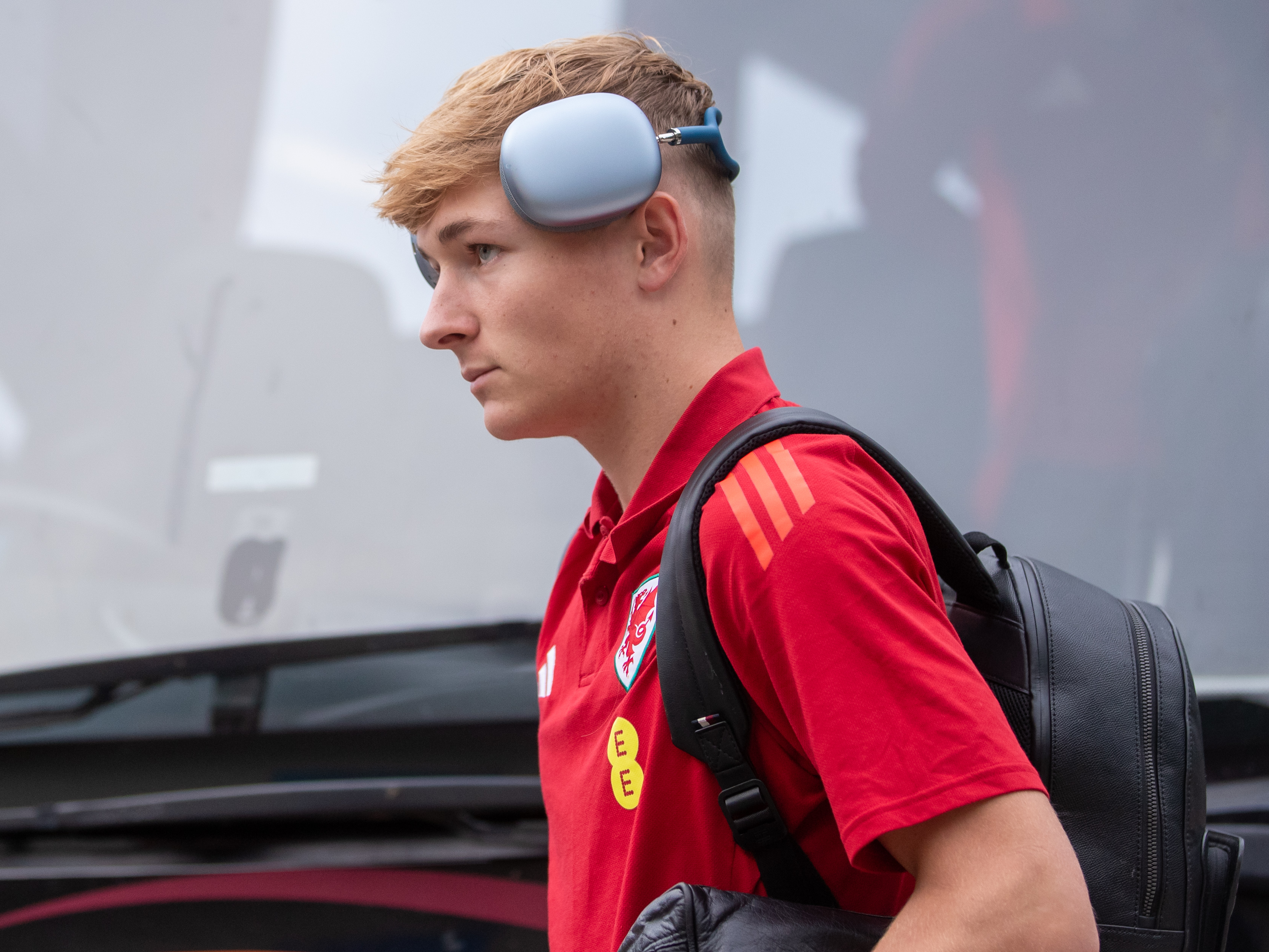 A photo of Albion youngster Ollie Bostock in Wales travel gear