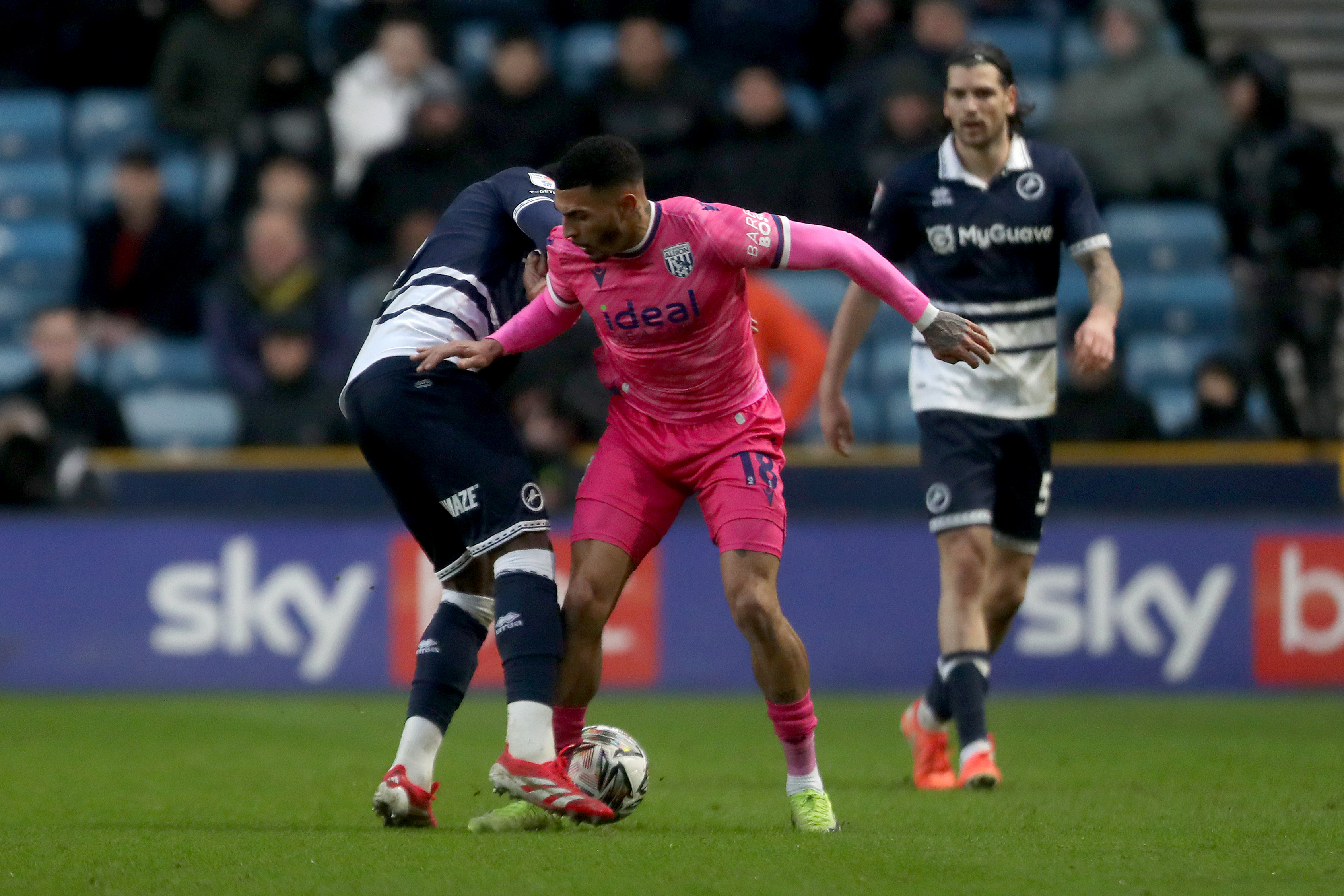 Karlan Grant in action at Millwall in February 2025 in the pink away kit 