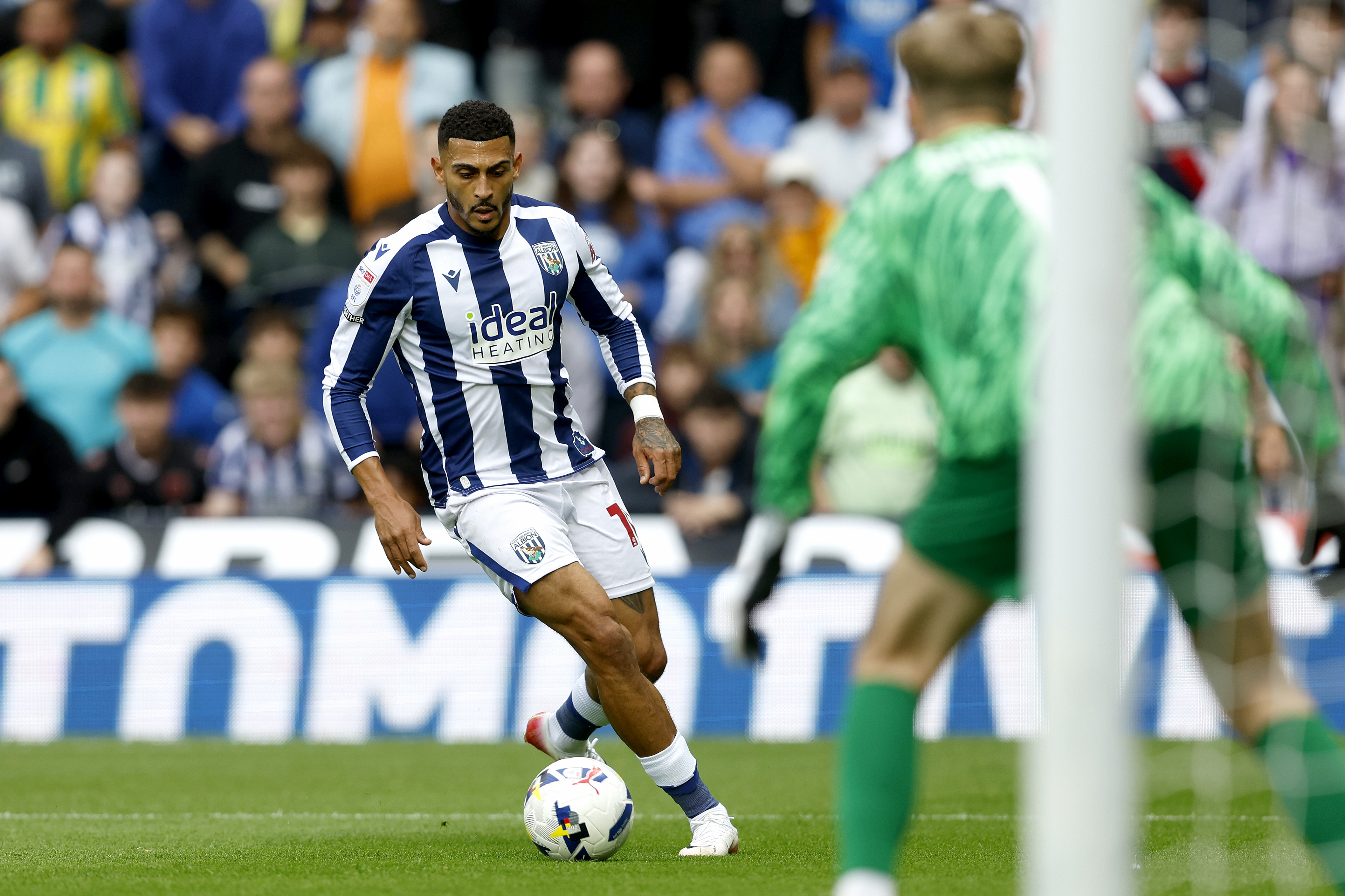 Karlan Grant in action for Albion in the home kit at The Hawthorns
