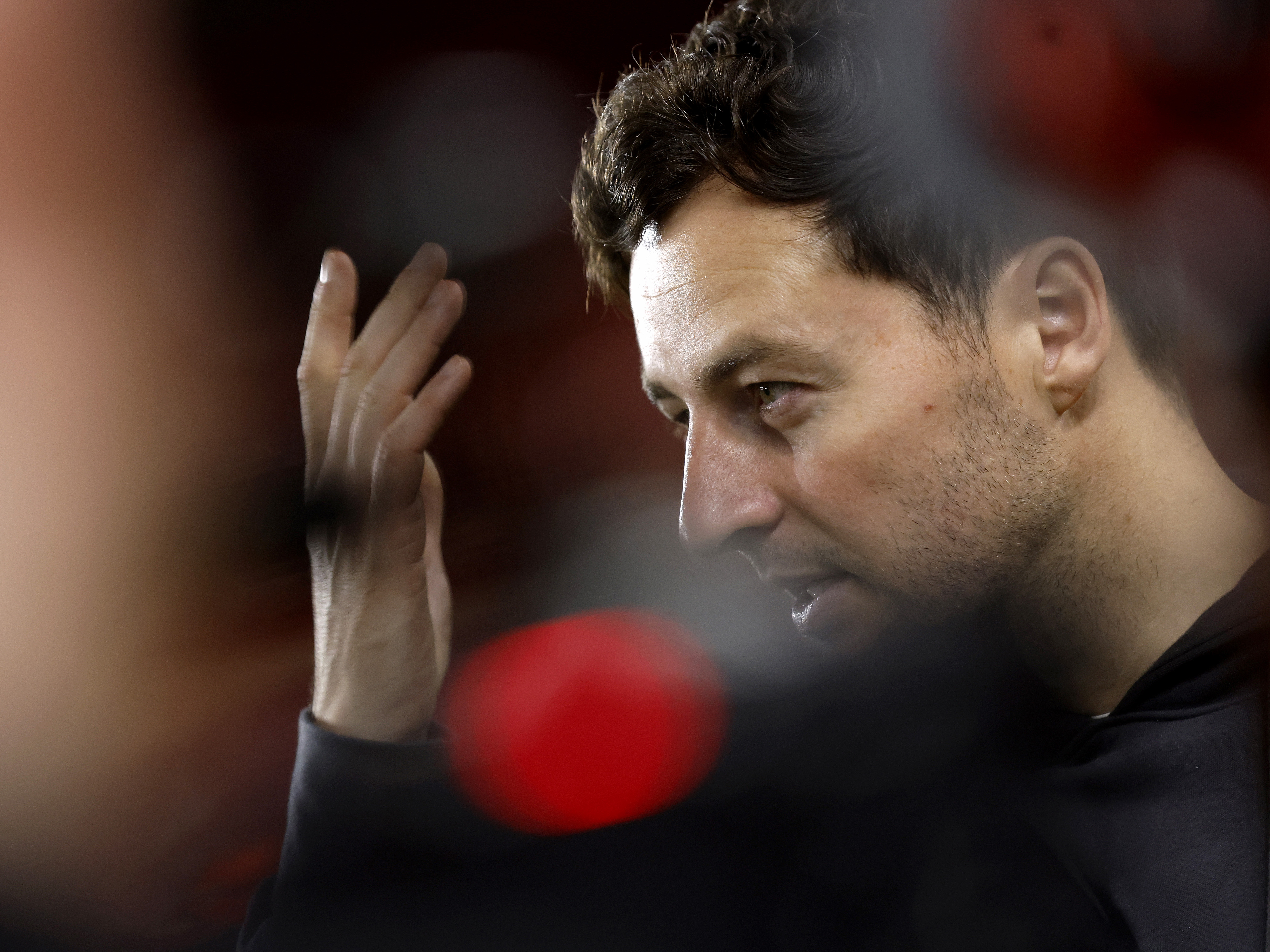 A close up of Ryan Mason talking to the media 