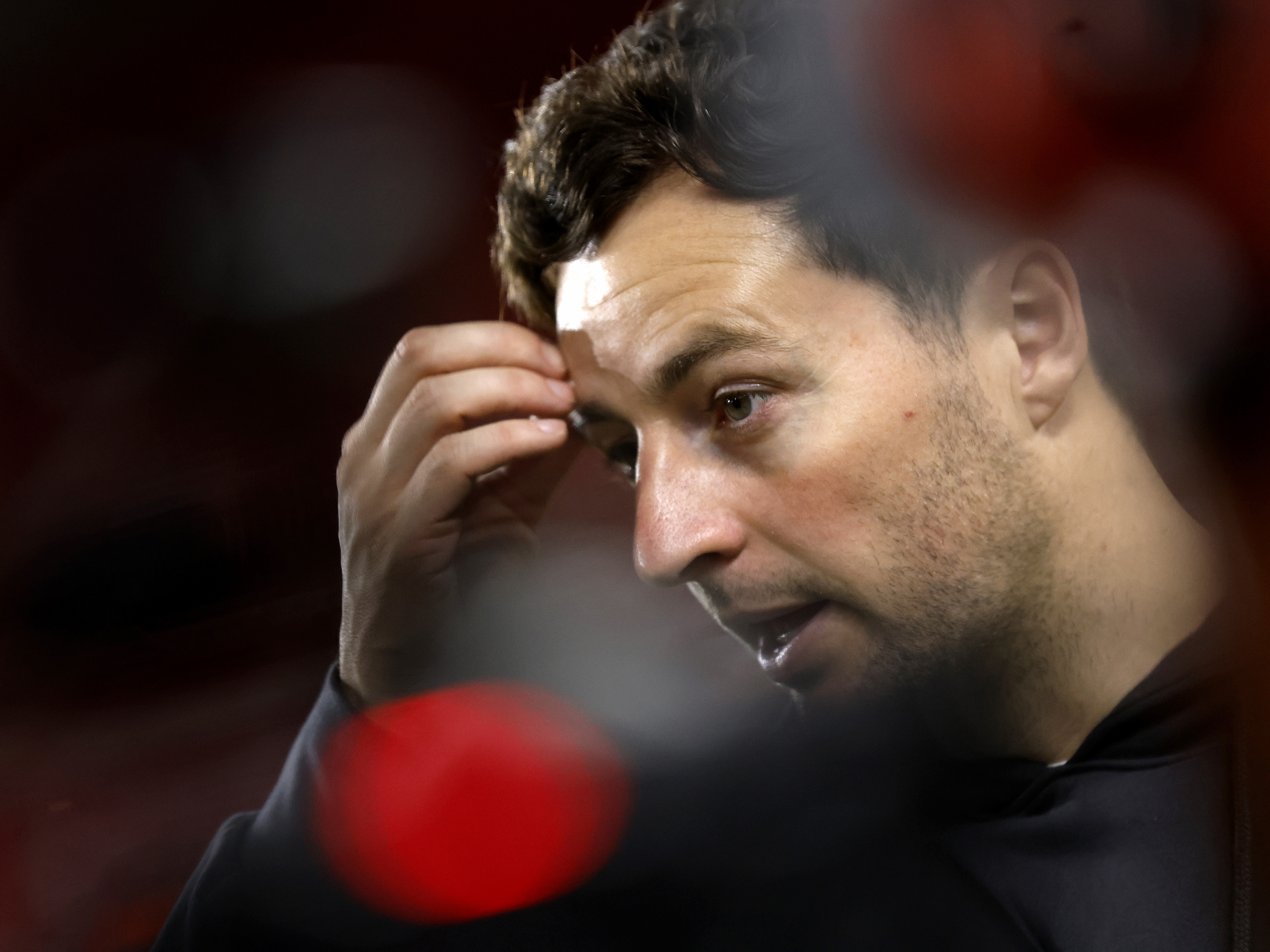 A close up of Ryan Mason talking to the media 