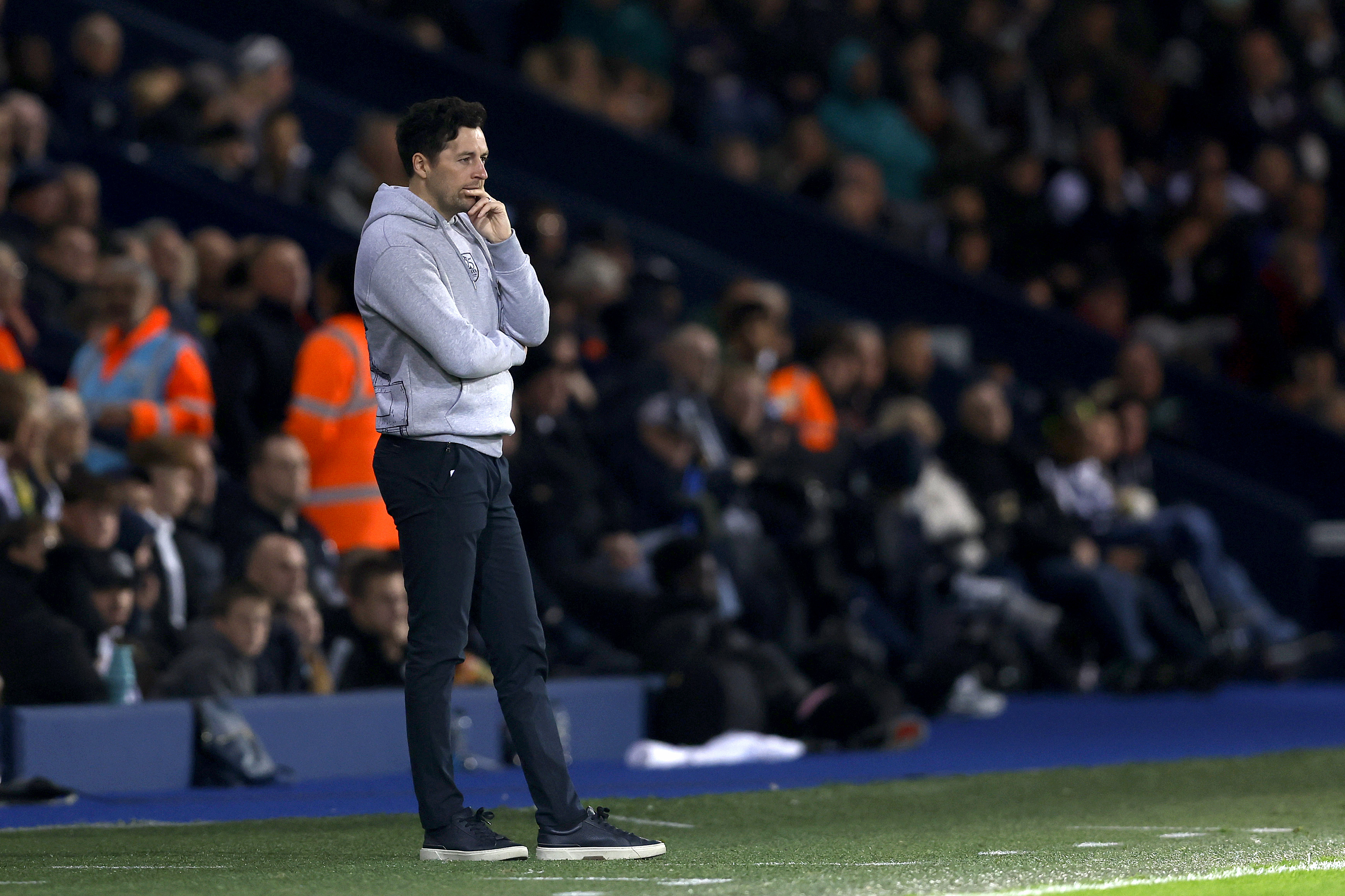 Ryan Mason watching WBA while stood on the side of the pitch at The Hawthorns