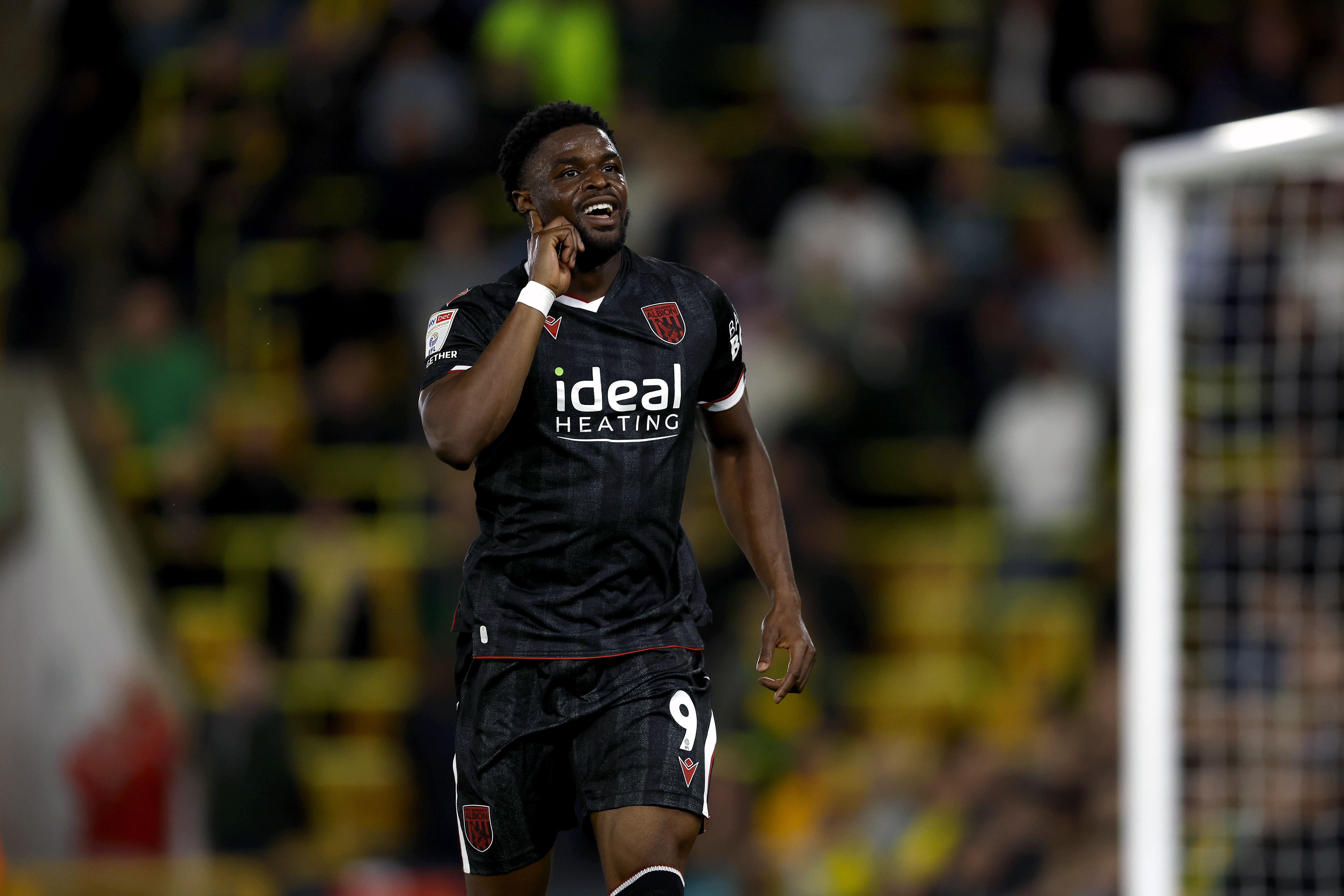 Josh Maja celebrates scoring at Norwich in the black kit 
