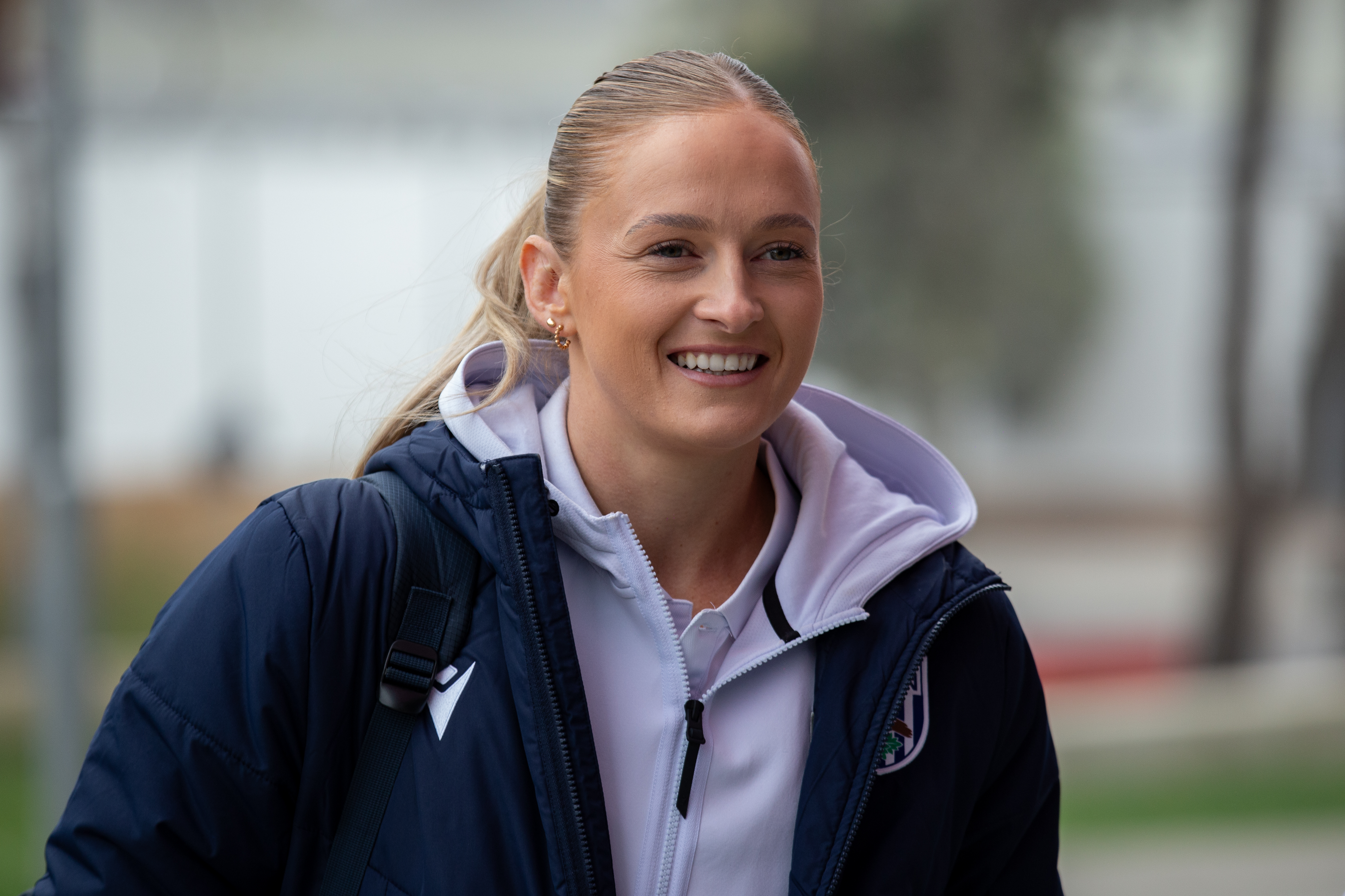Zoe Creaney smiling as she arrives for a game