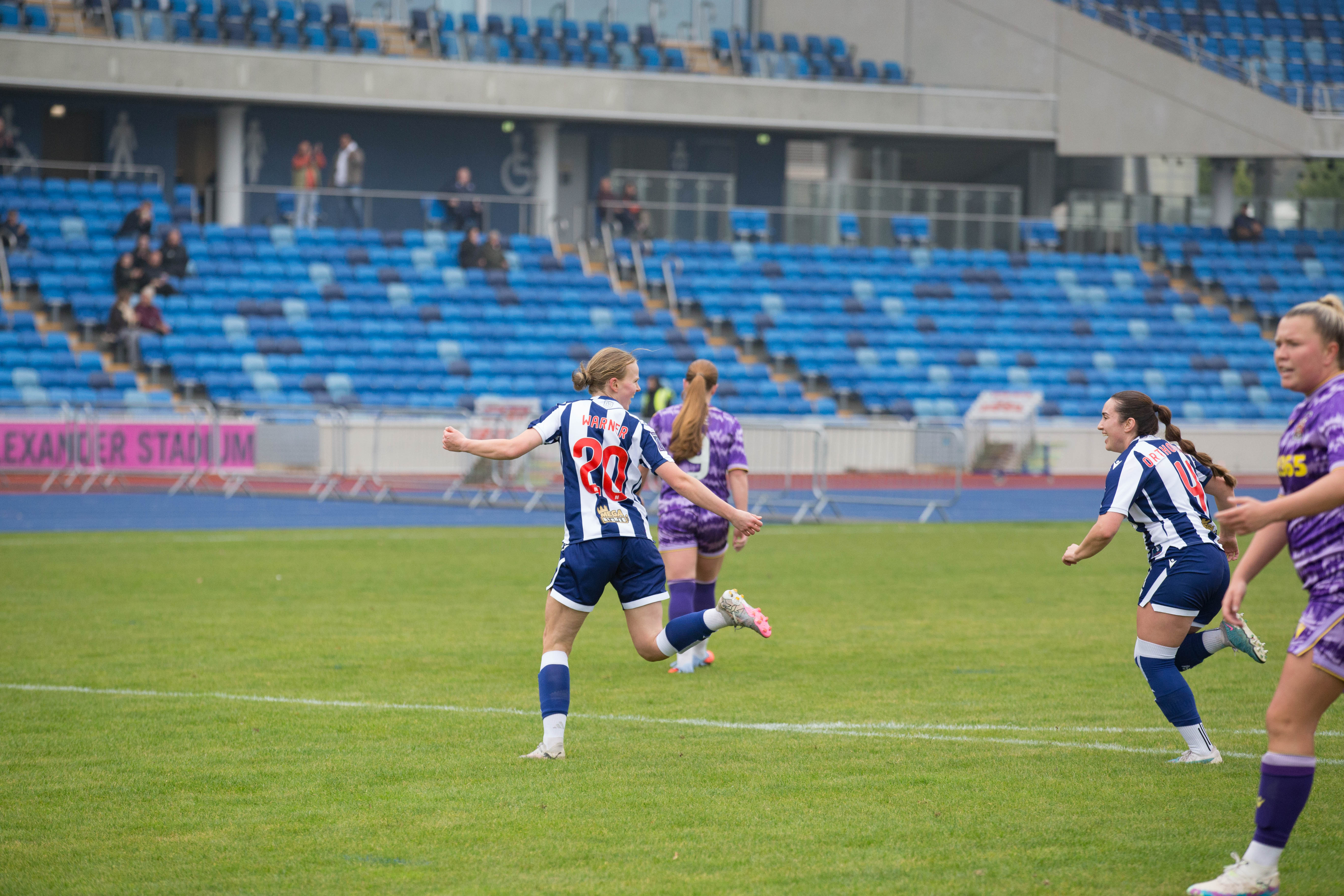 Phoebe Warner celebrates at the Alexander Stadium.