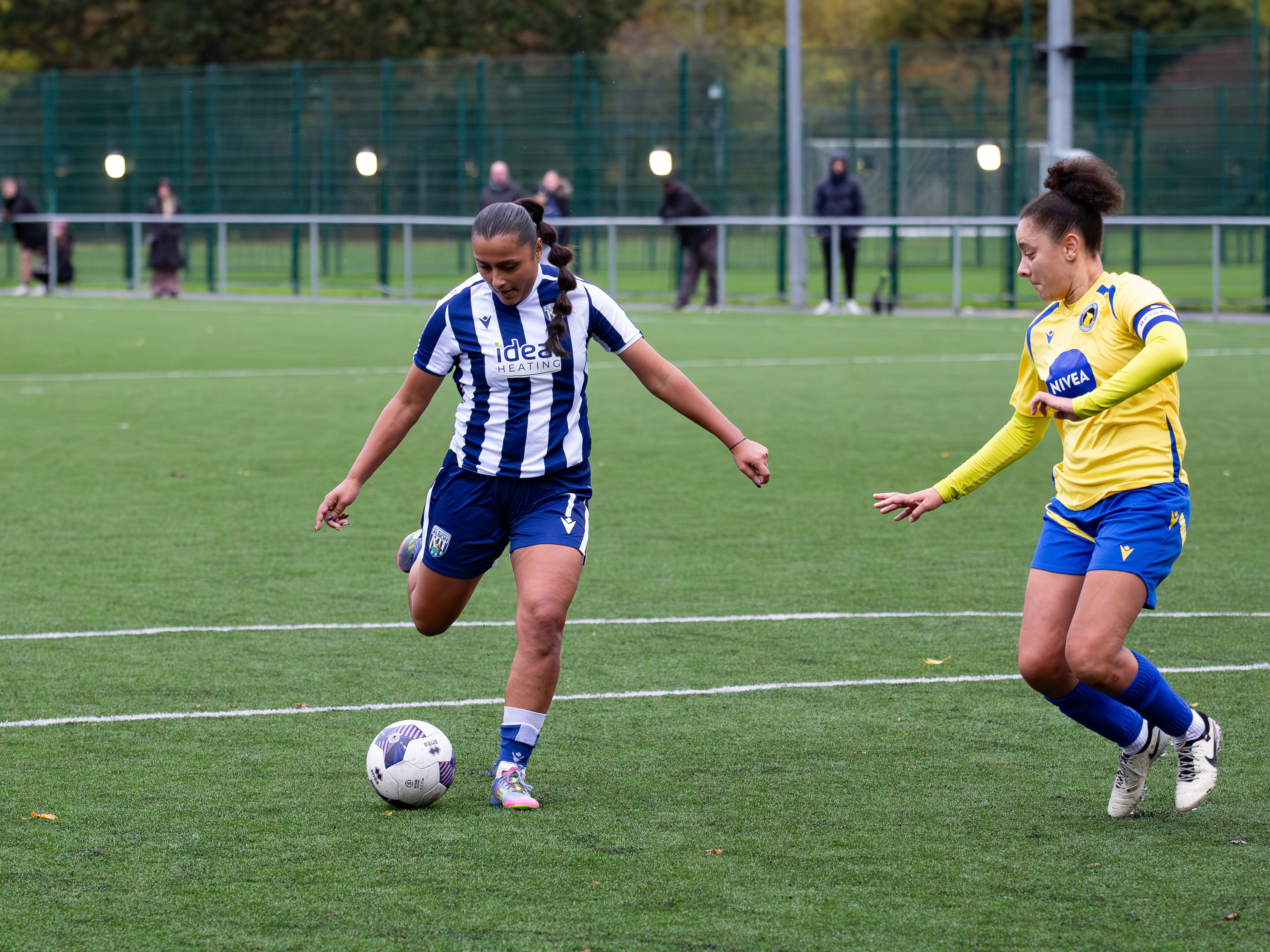Simran Jhamat on the ball against Solihull in the home kit 
