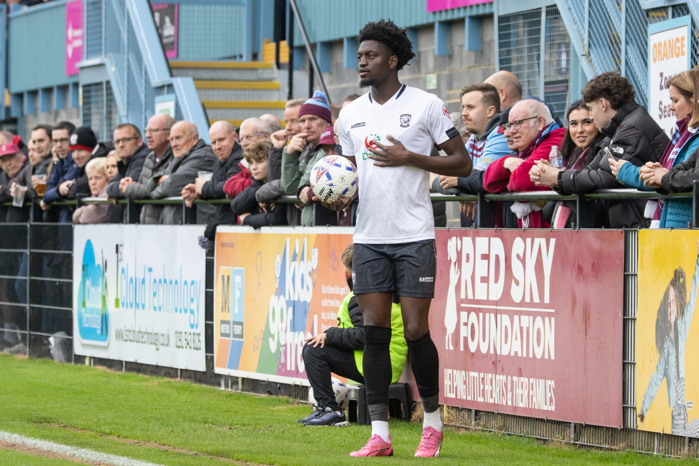 Michael Parker preparing to take a throw for Hereford in their home kit