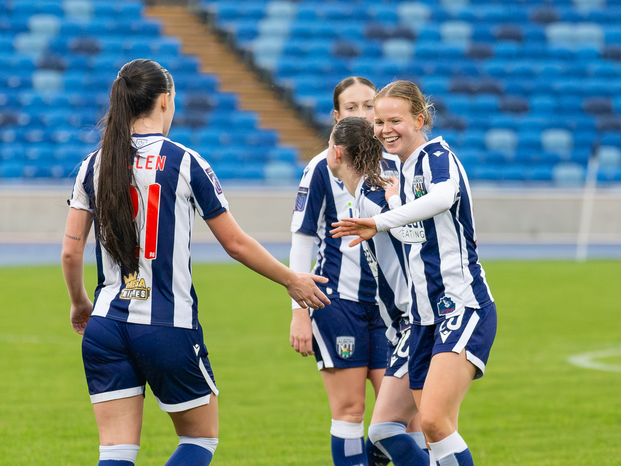 A photo of Phoebe Warner celebrating her goal 