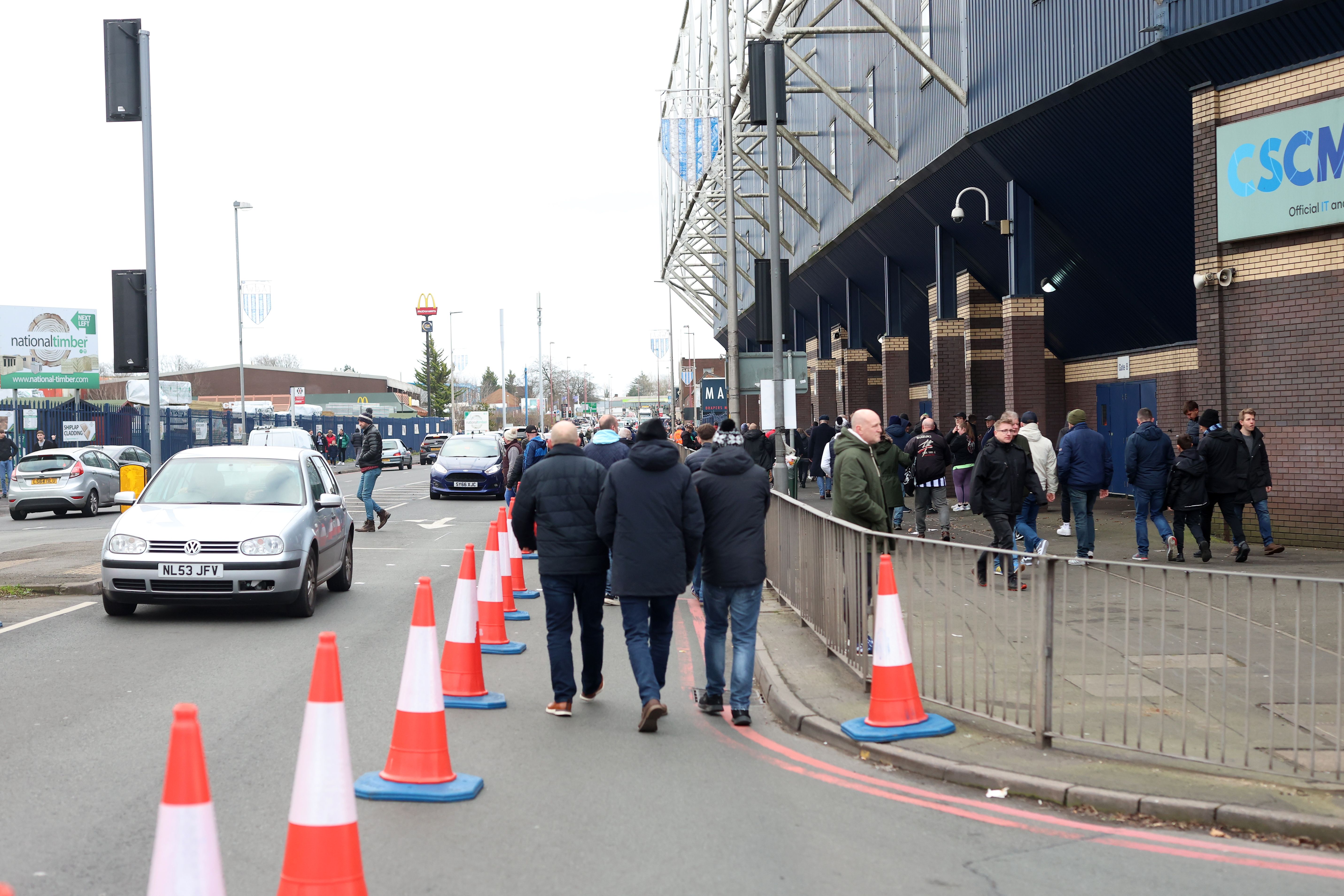 Traffic on the Birmingham Road outside The Hawthorns with fans walking to the stadium