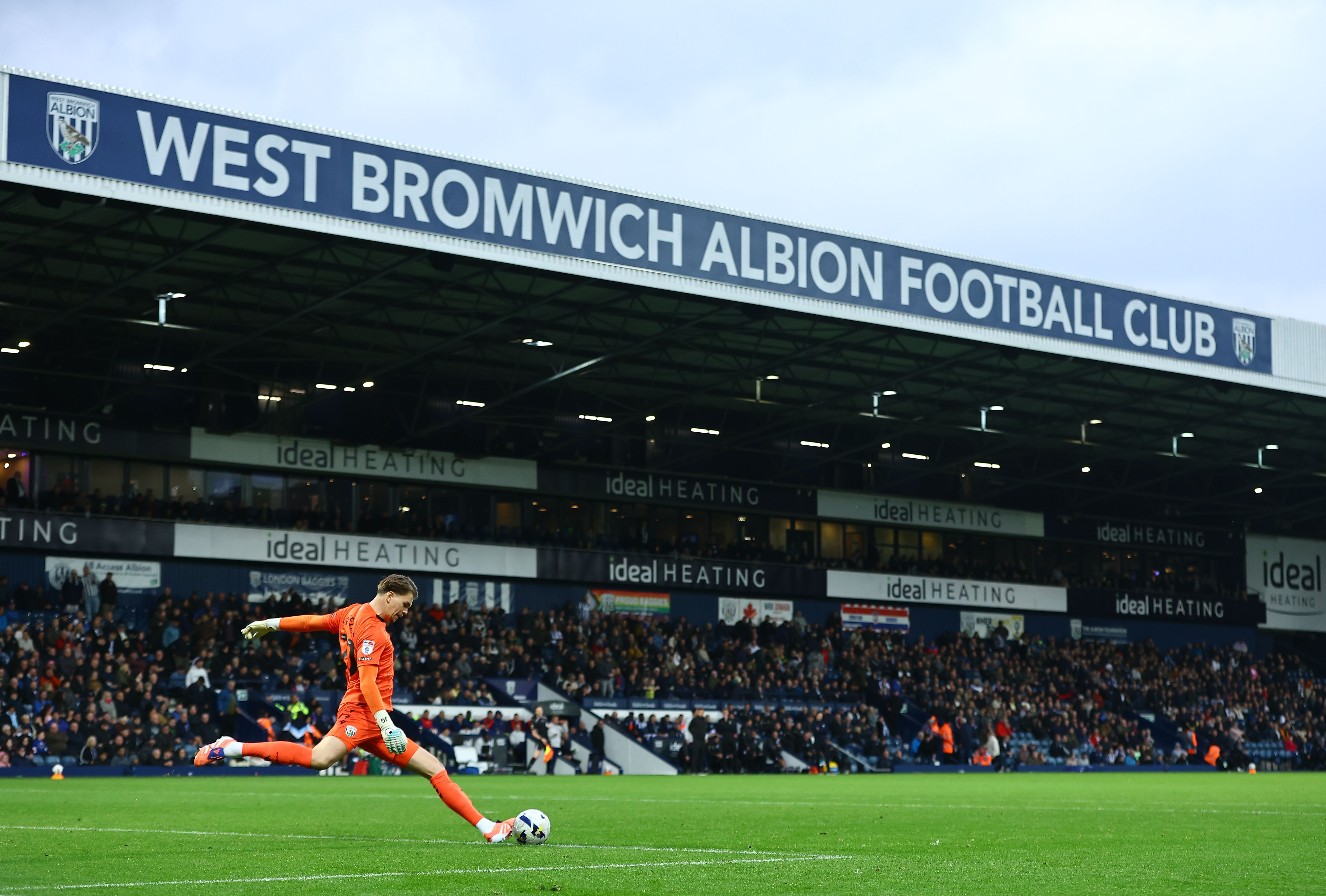 Josh Griffiths in action against PNE with the Halfords Lane stand in the background 