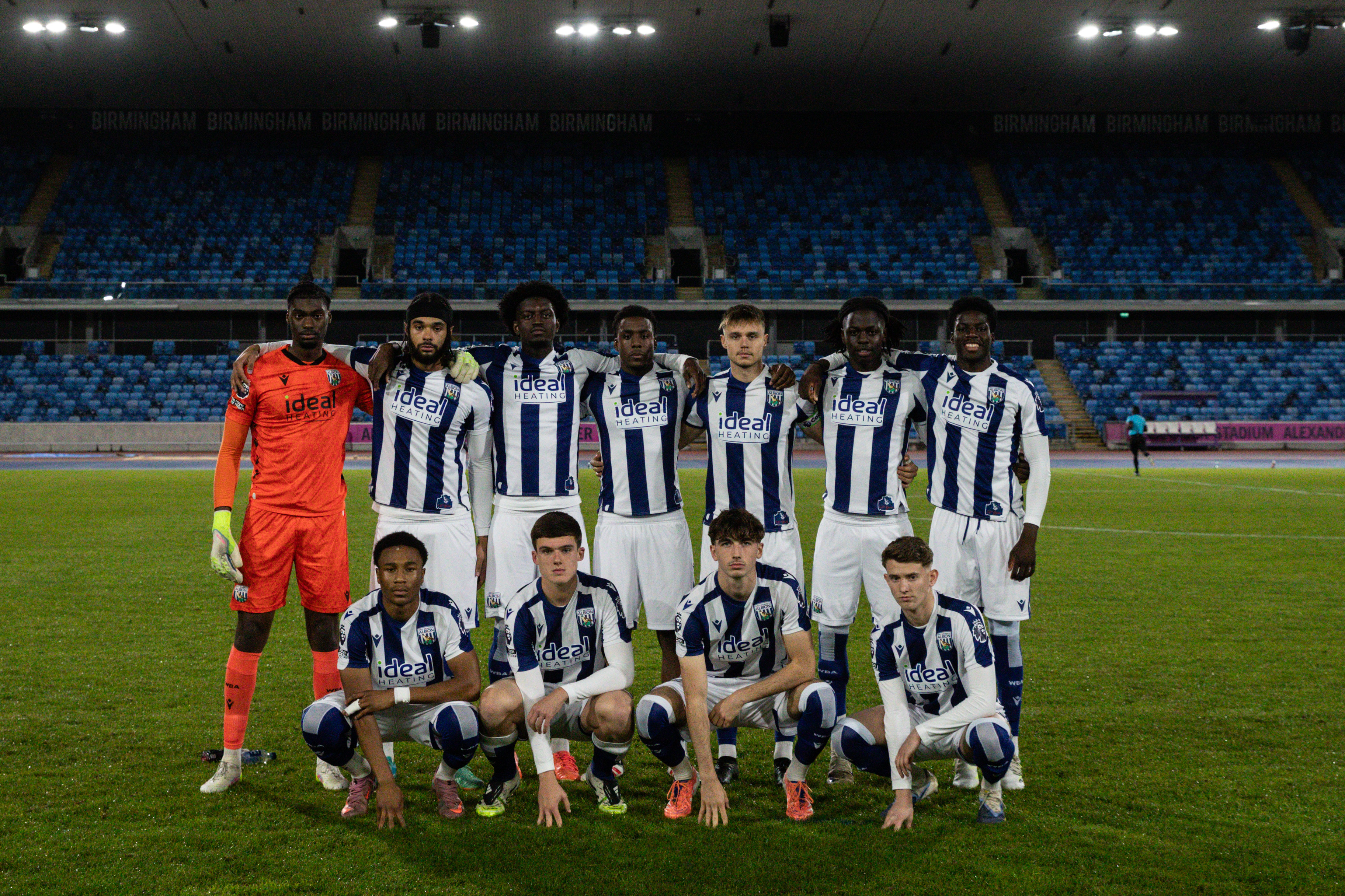 Albion's PL2 team pose for a team photo before playing a game in the home kit at the Alexander Stadium