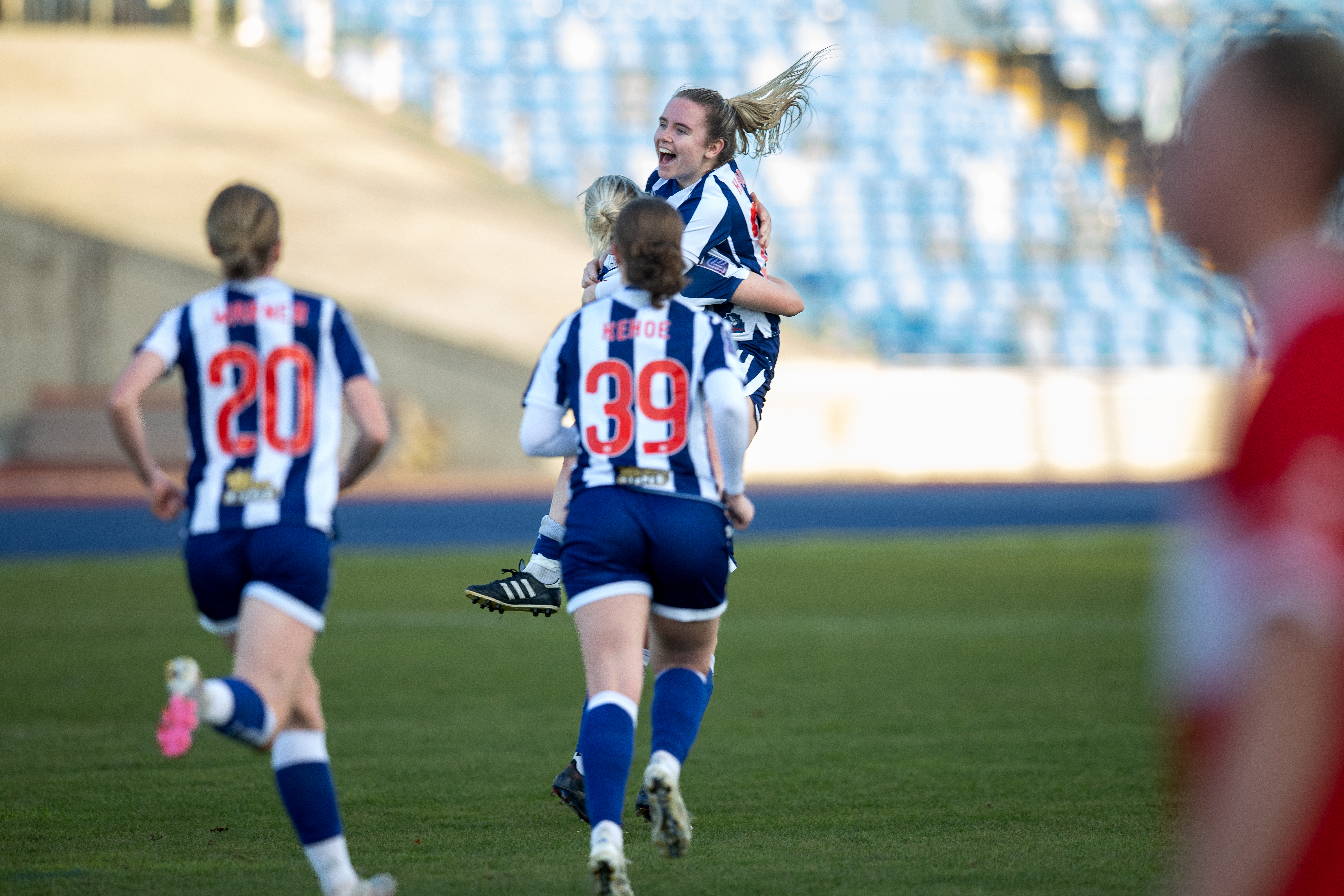 Albion Women celebrate Hannah George's free-kick goal.