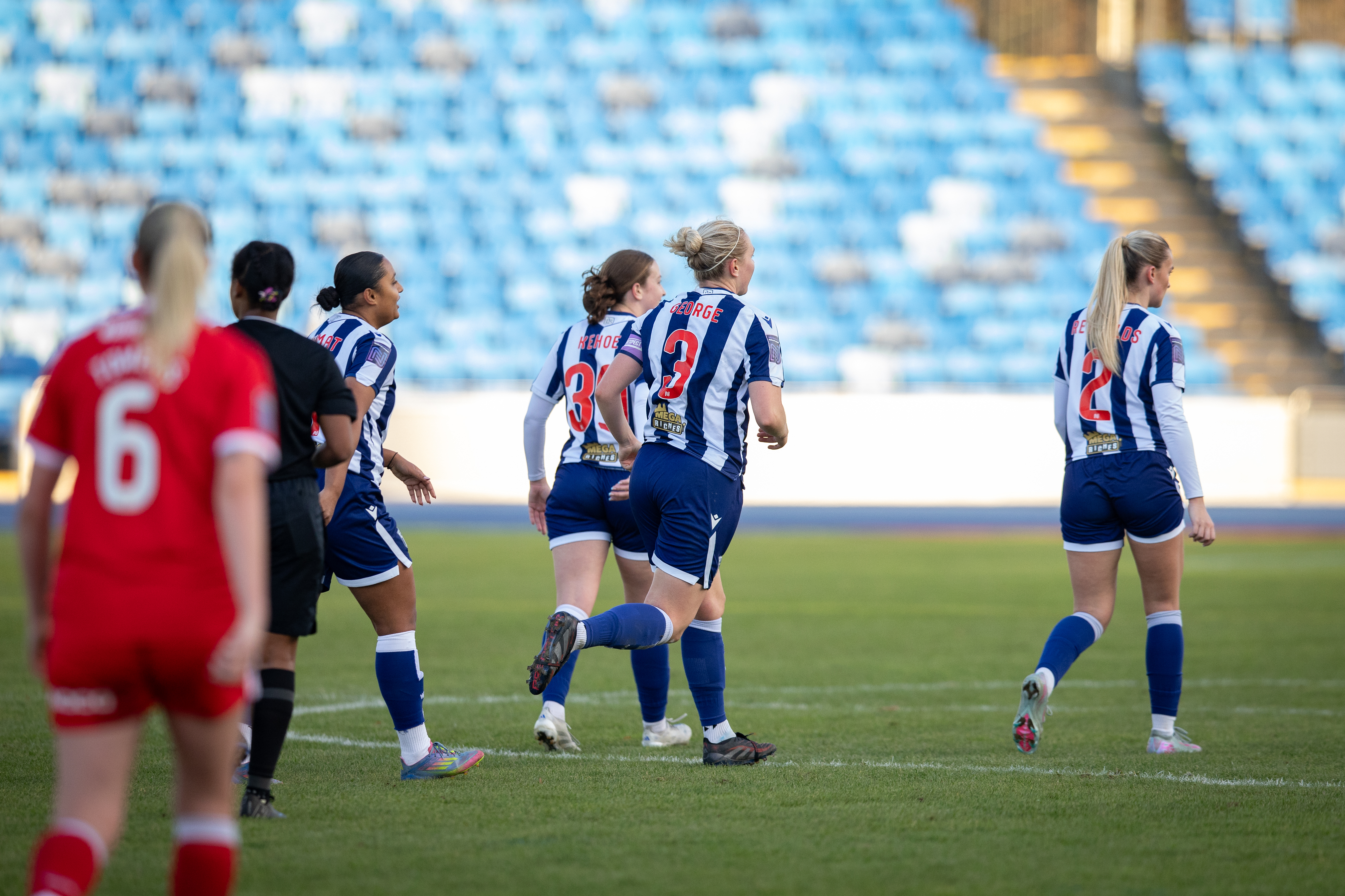 Hannah George runs back into position after scoring for WBA v Middlesbrough