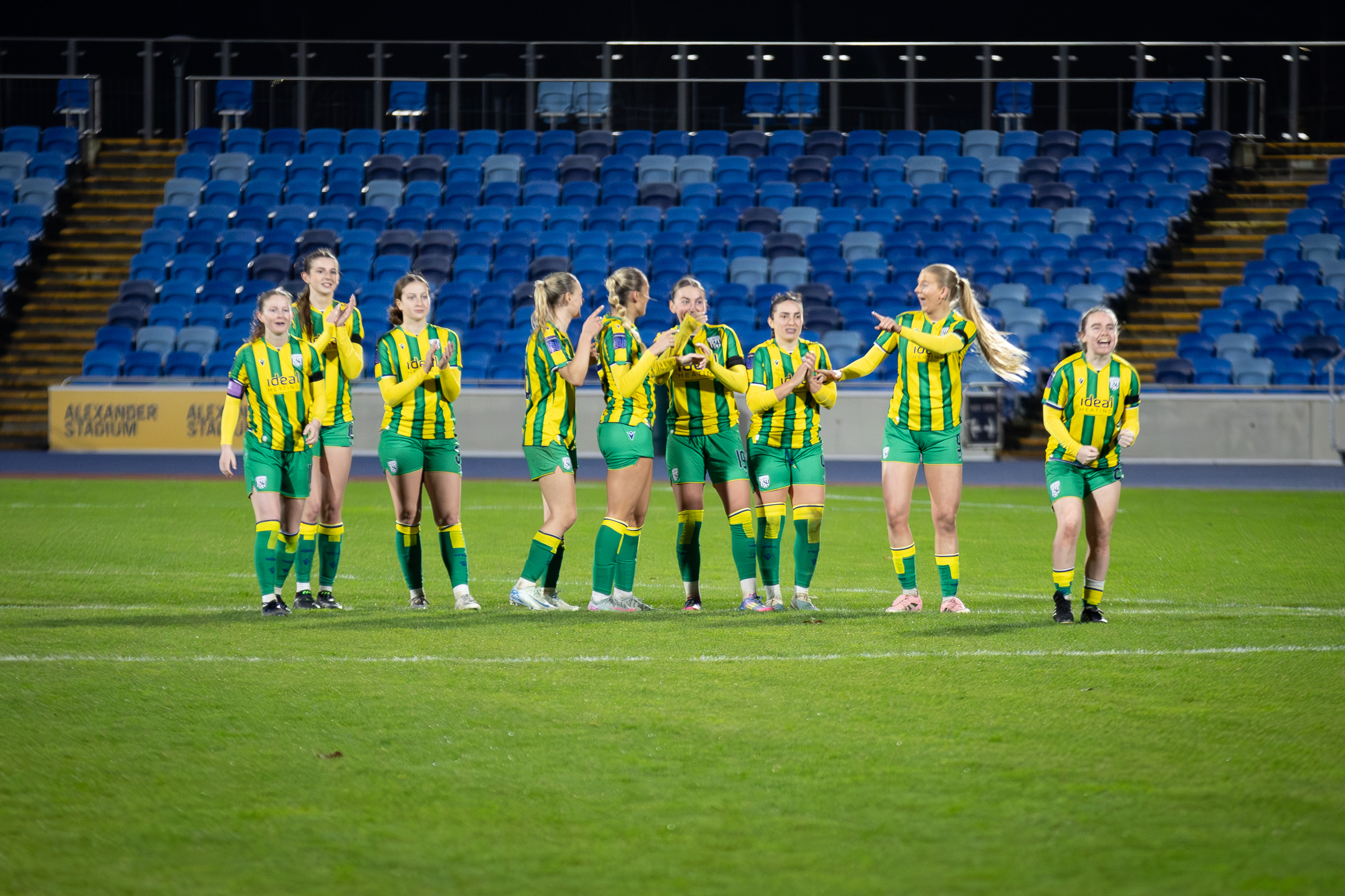 Albion Women celebrating their penalty shootout win against Leeds United.
