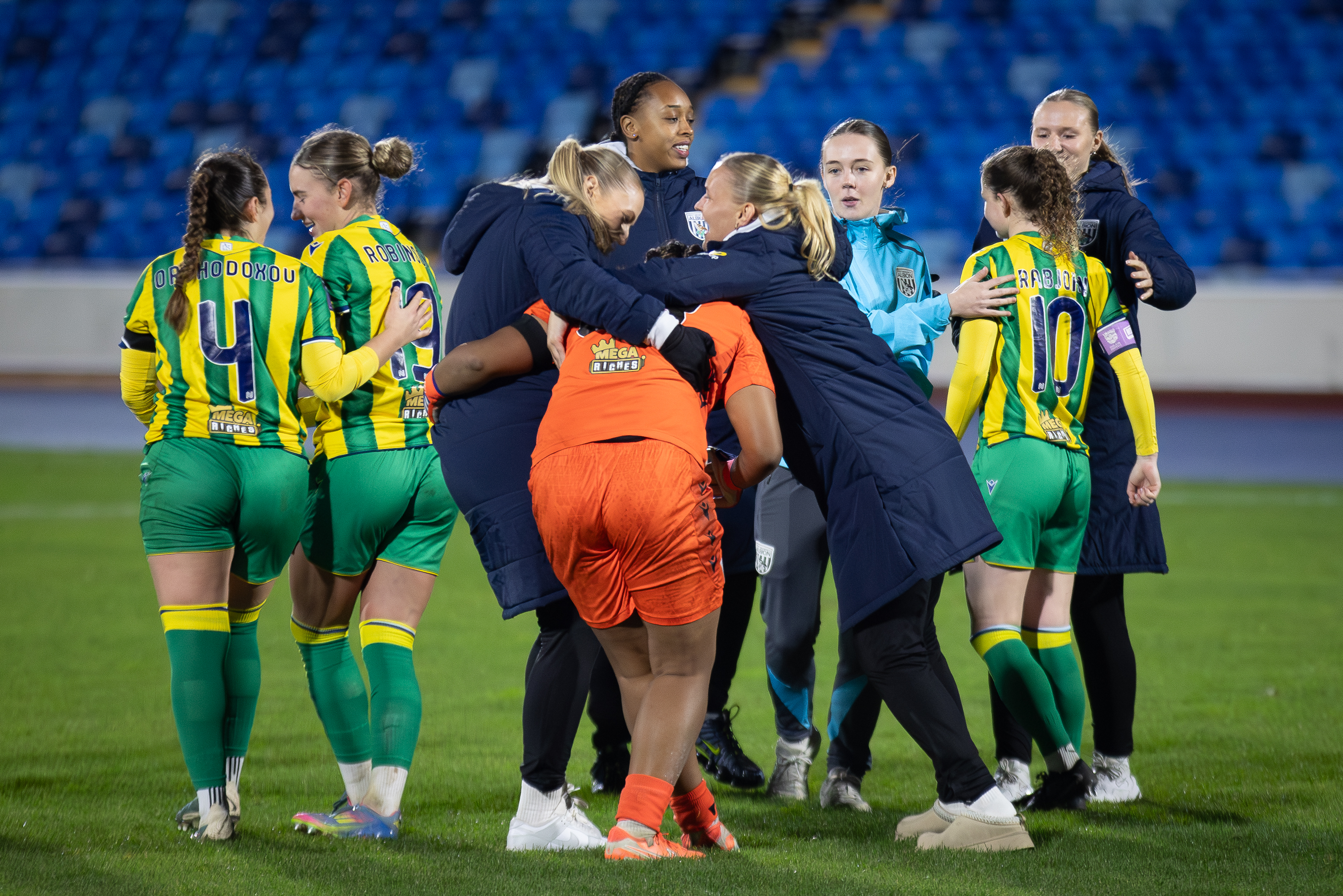 Several Albion Women players congratulate Lavarna Johnson after her penalty saves against Leeds