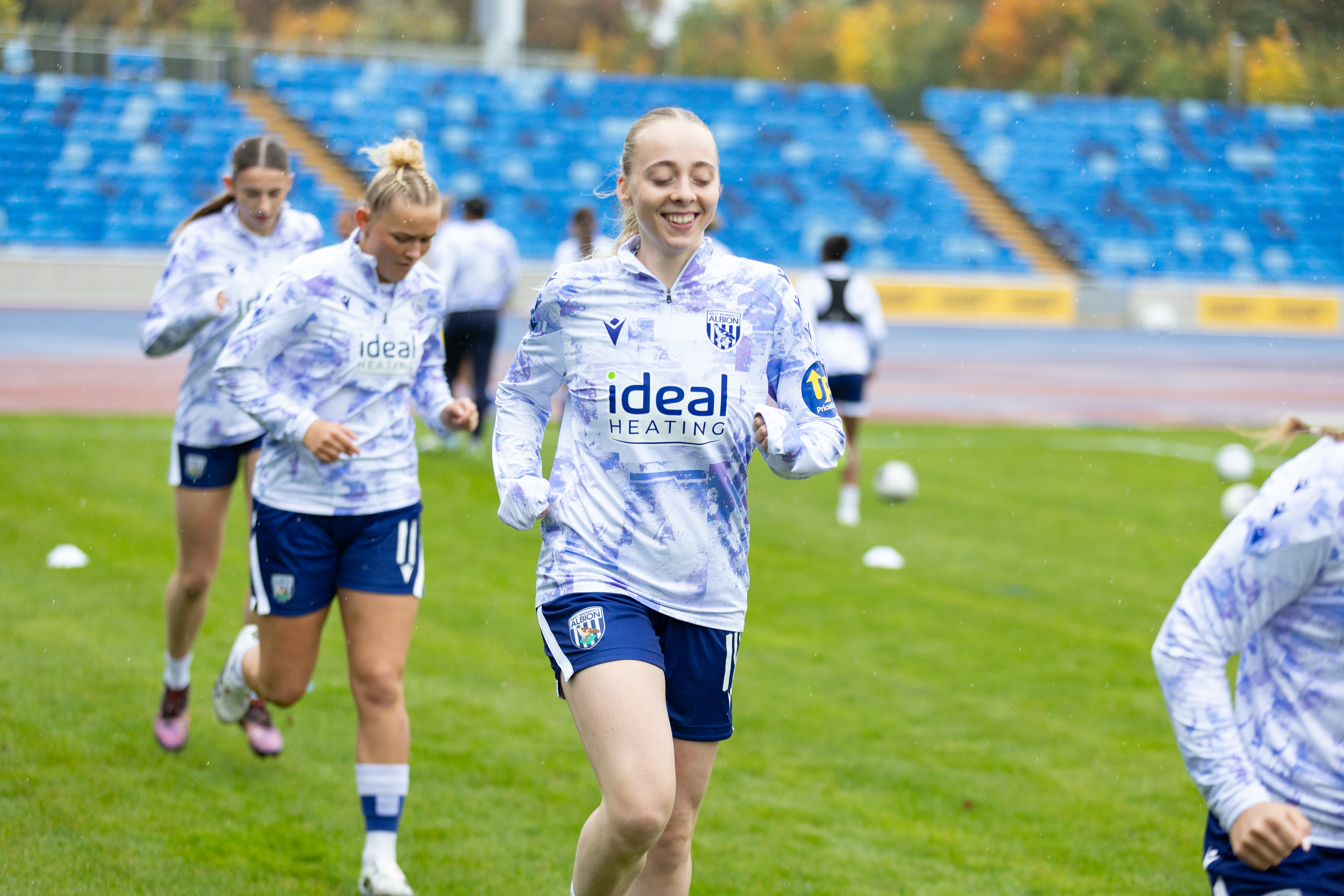 Ellie May smiling while warming up before a game
