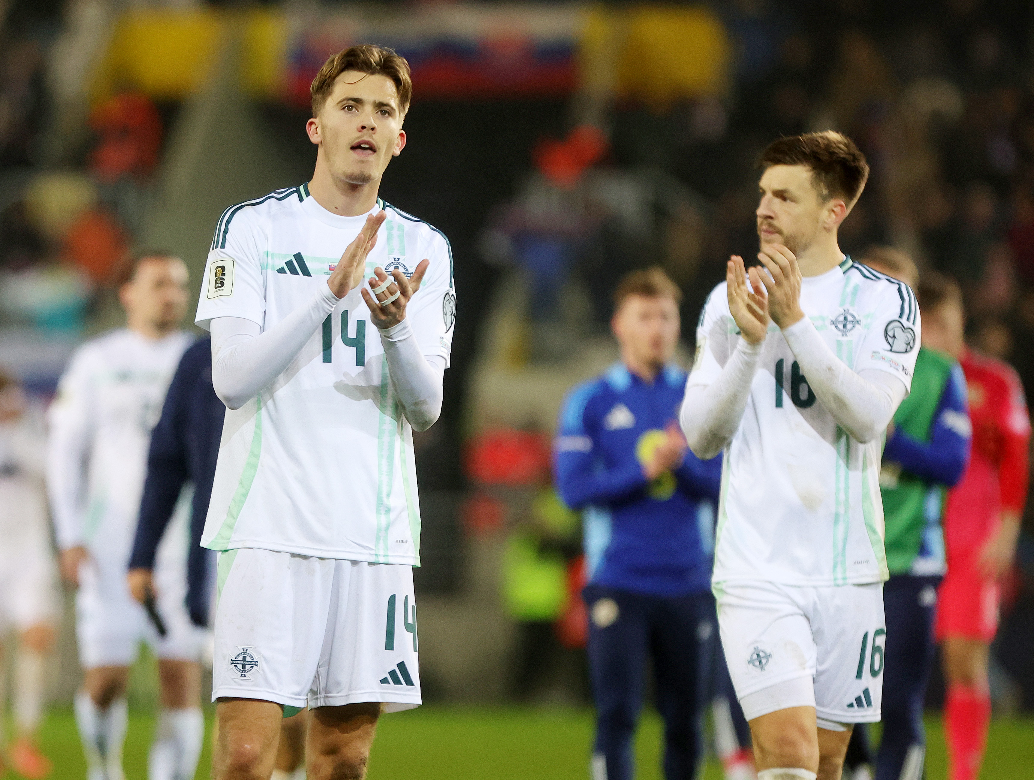 Isaac Price claps the Northern Irish fans.