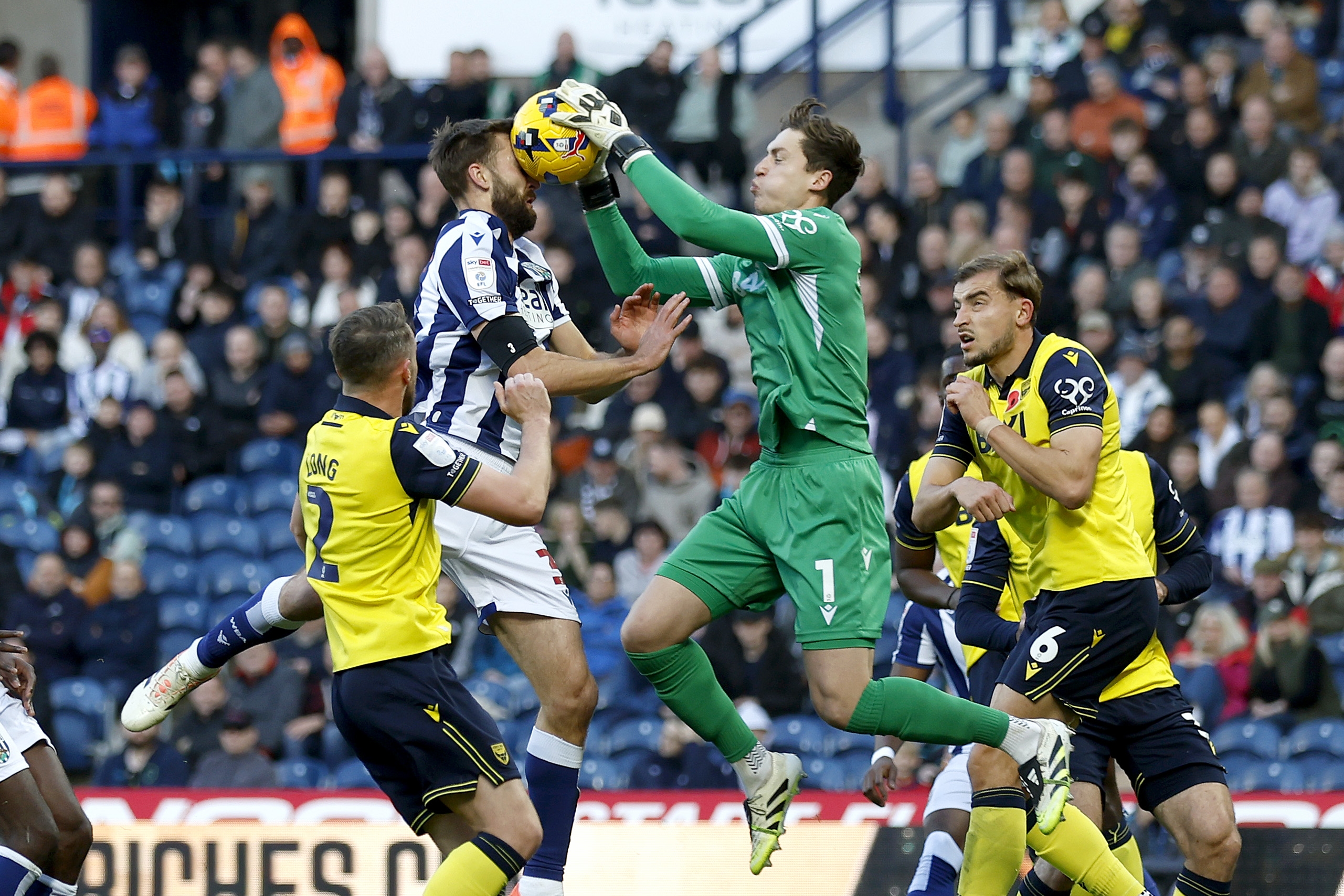 General match action between WBA and Oxford with Nat Phillips jumping for the ball