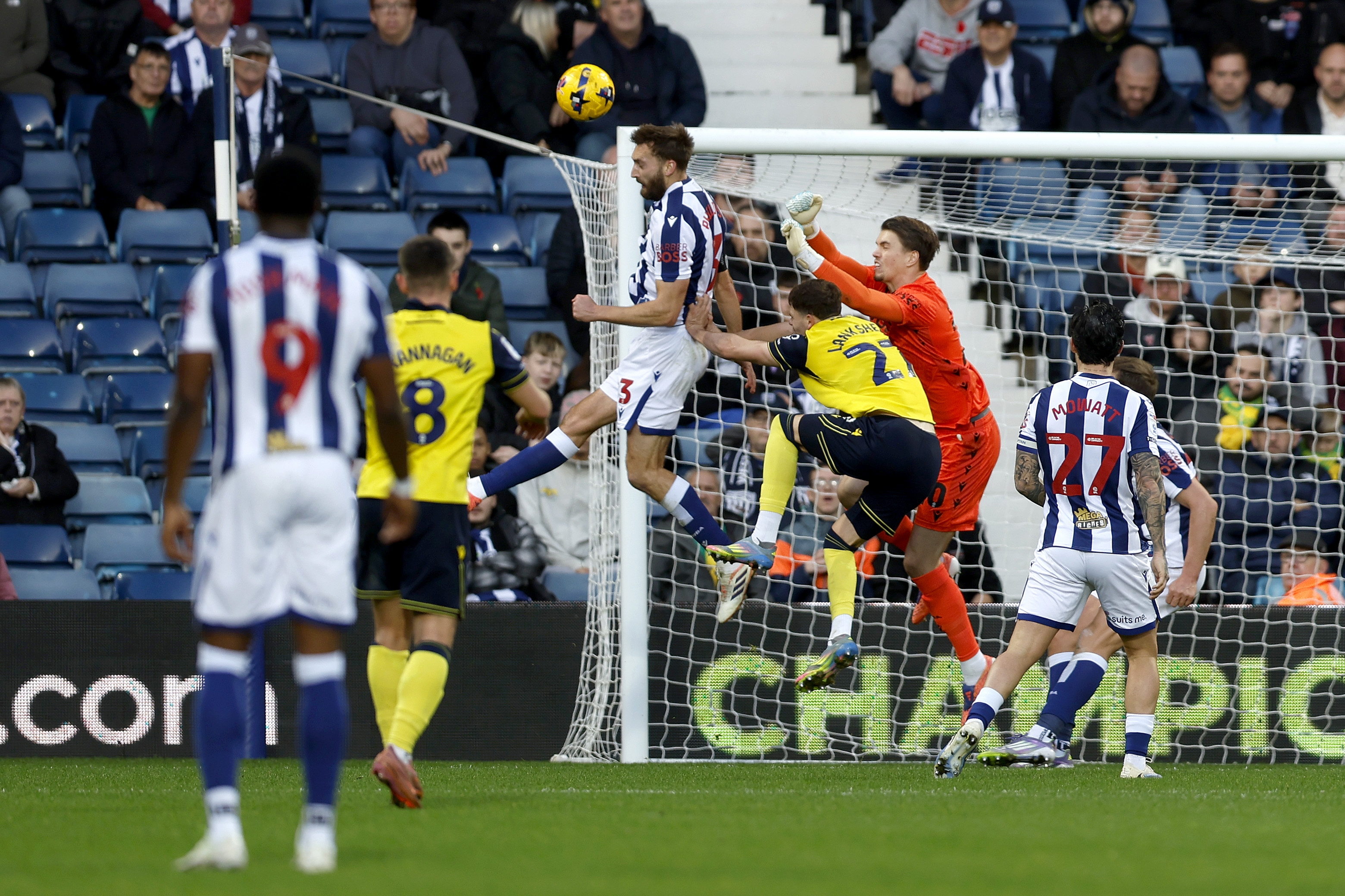 Nat Phillips heading the ball away against Oxford 