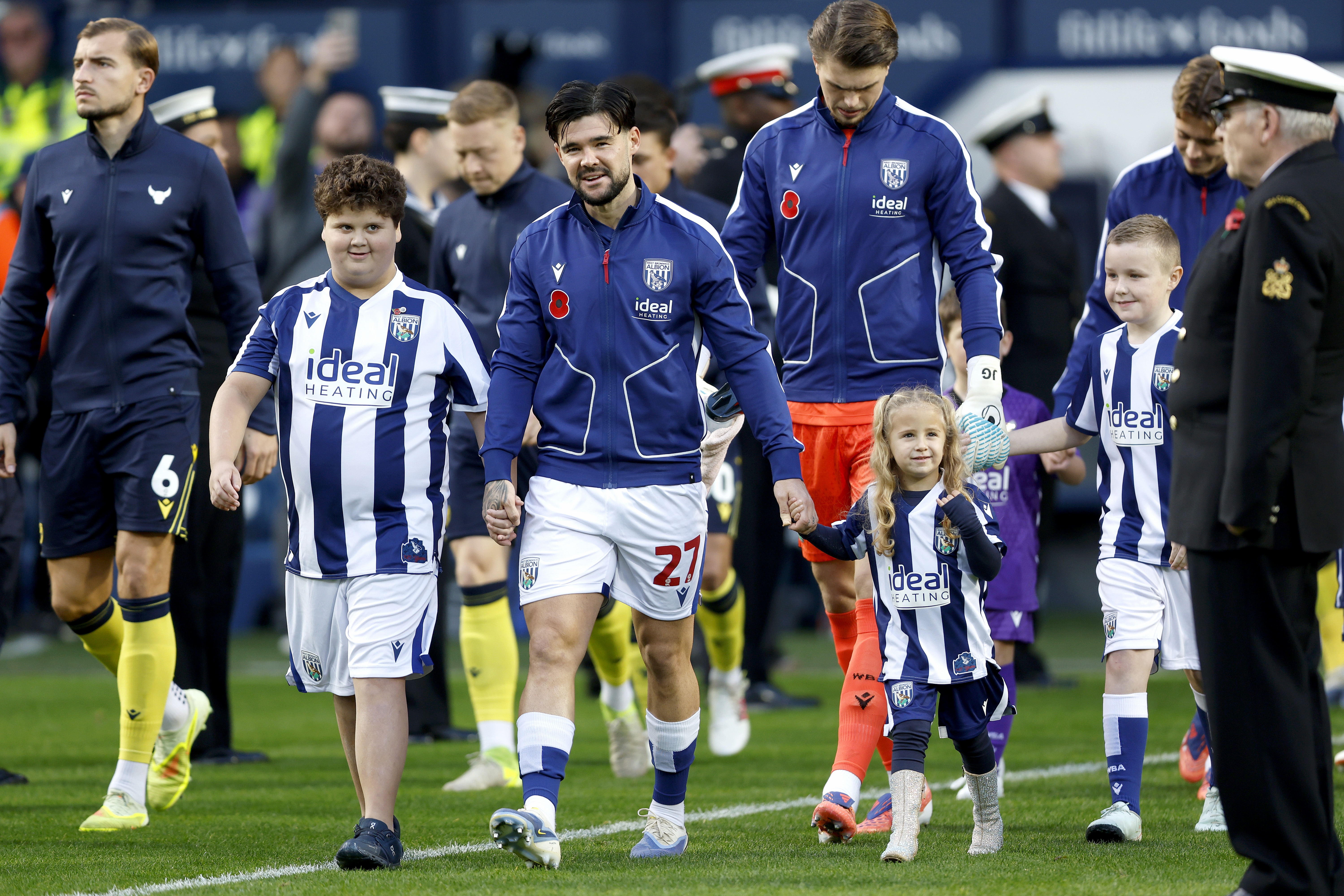 Alex Mowatt leading WBA out at The Hawthorns for the Oxford game
