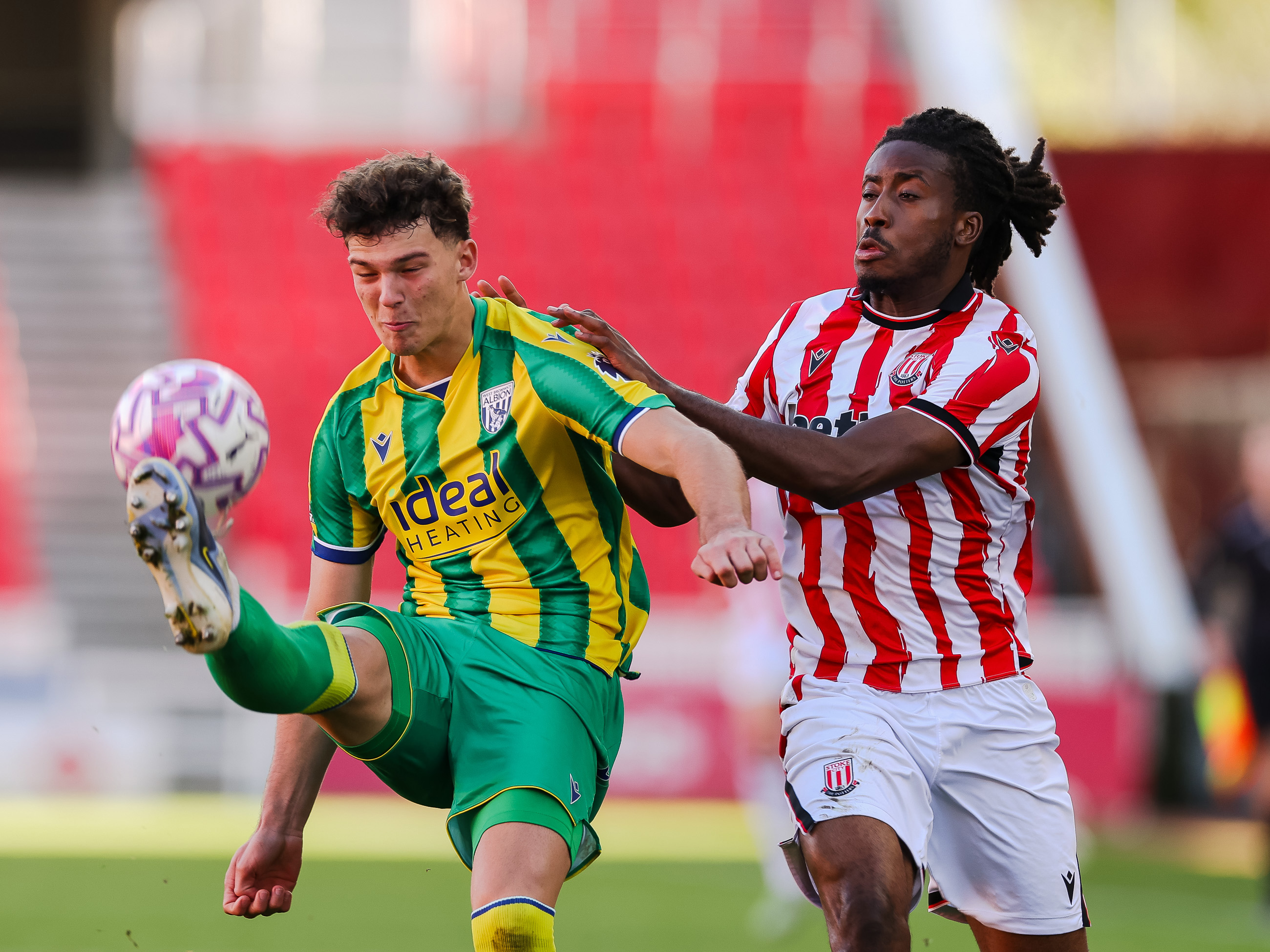 A photo of Albion U21 defender Noah DuPont in the 2025/26 green and yellow away kit