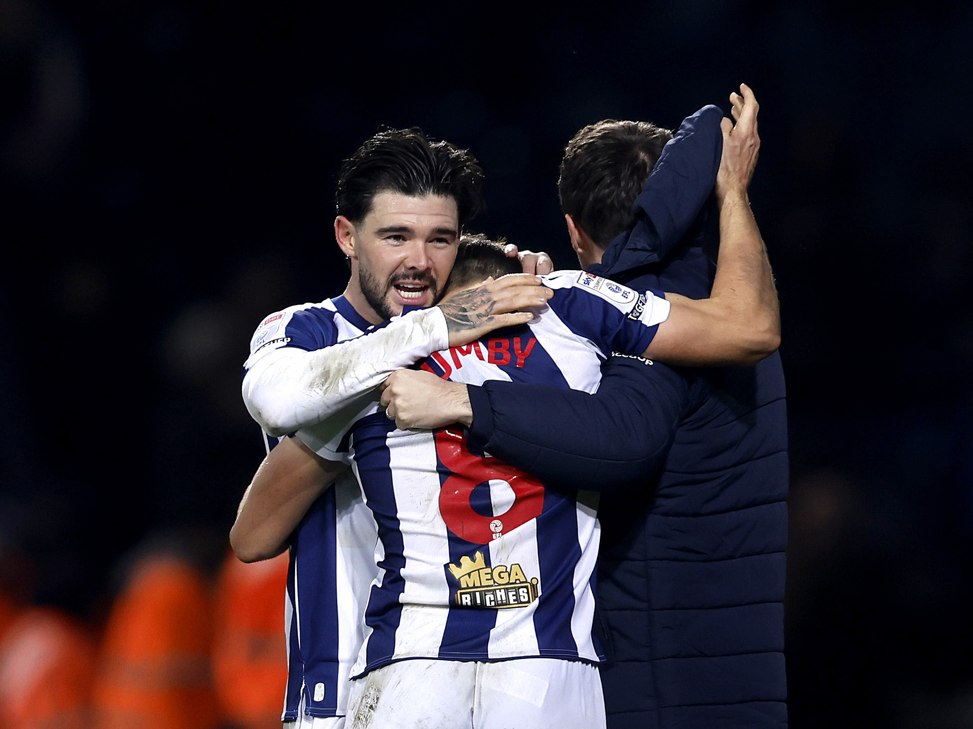 Jayson Molumby and Alex Mowatt celebrate after the win over Swansea 