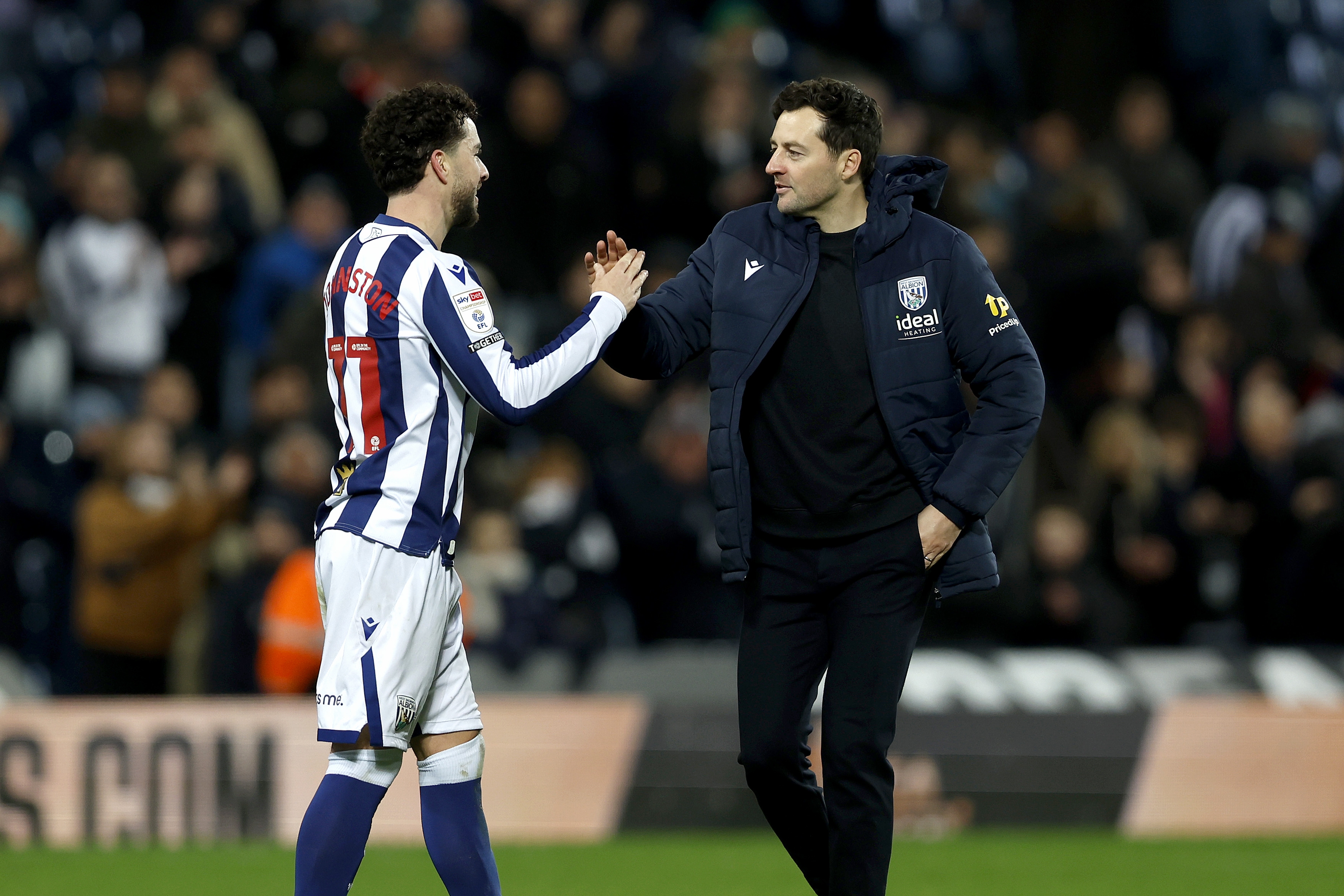 Mikey Johnston and Ryan Mason shaking hands after the Swansea win