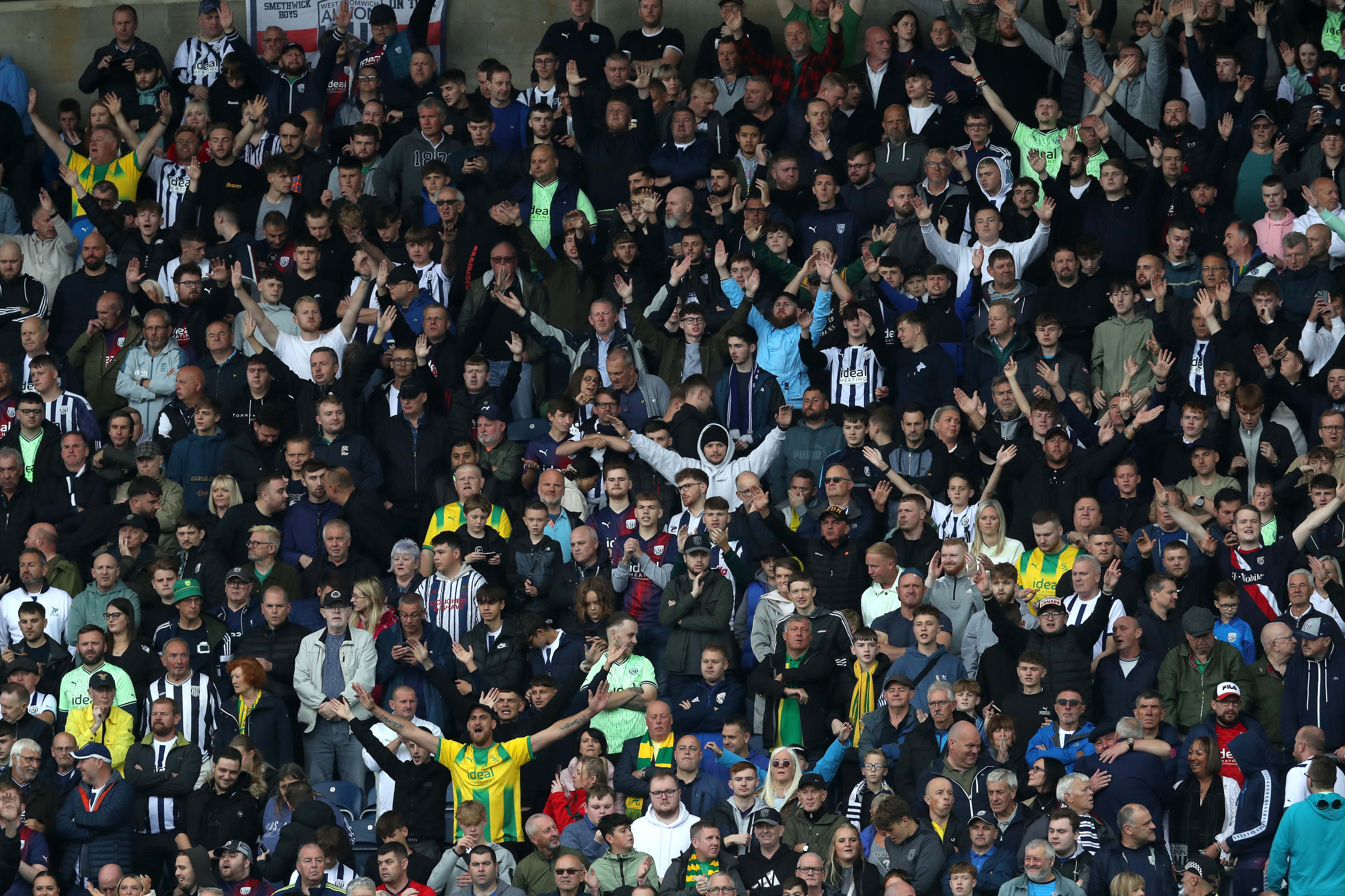 A general view of hundreds of WBA fans cheering in the stand at a game