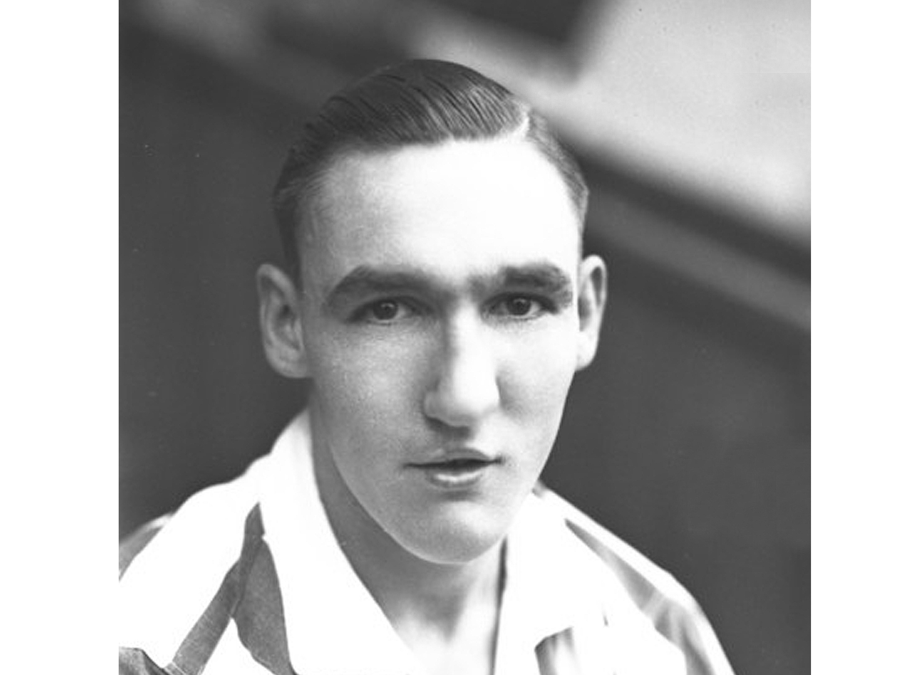 A close up shot of Harold White looking at the camera 