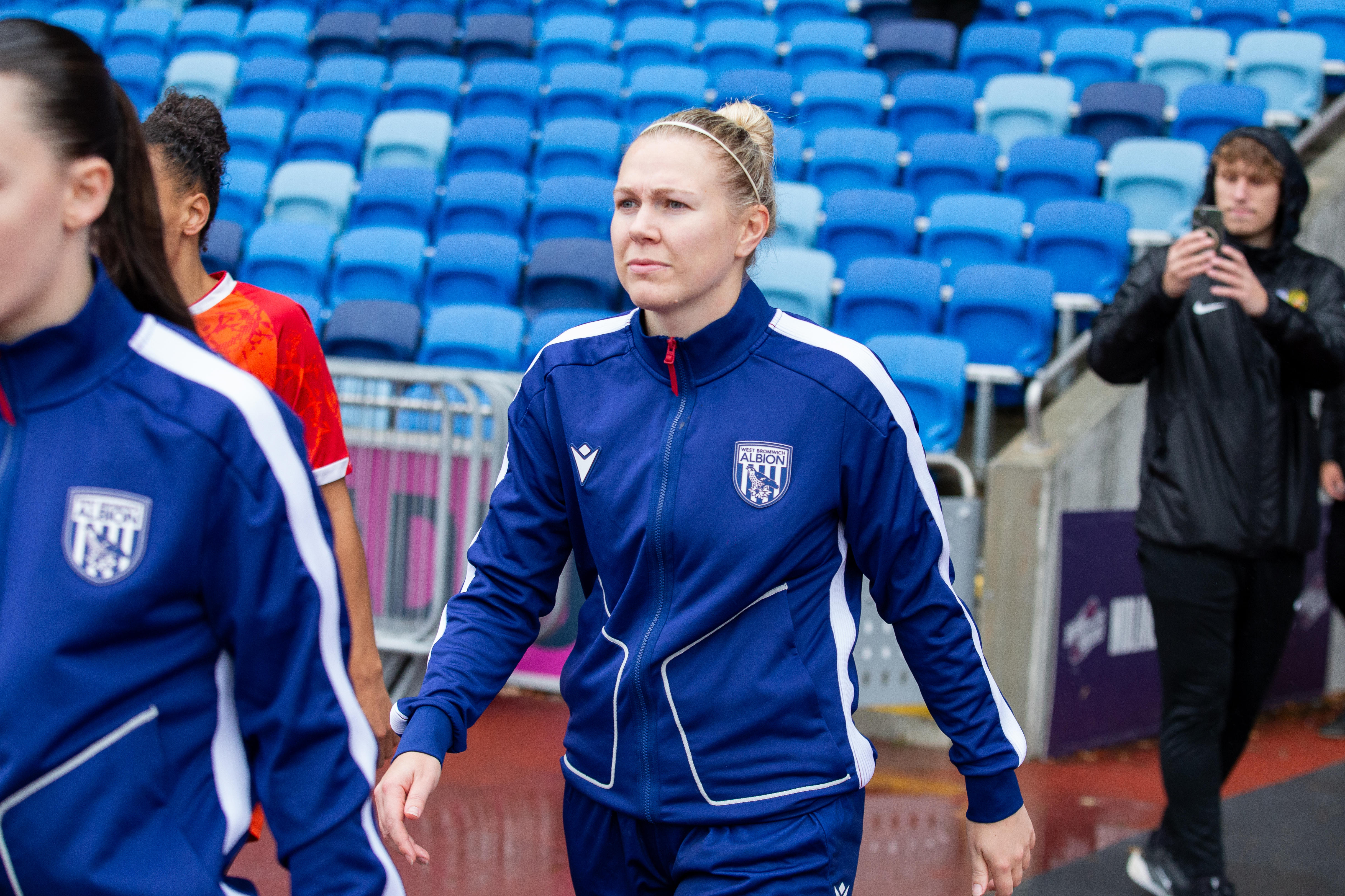 Hannah George walking out before a game at the Alexander Stadium in a WBA tracksuit 